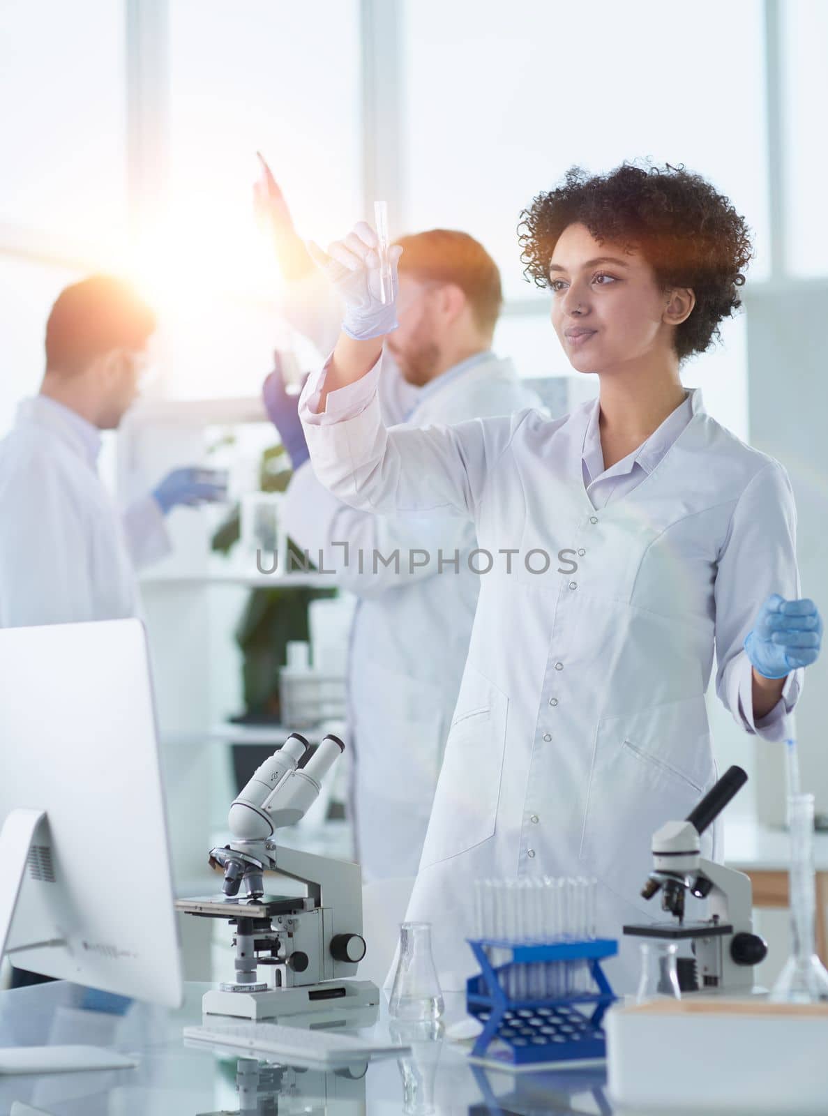 Team of Scientists Working Using Microscope, Analysing Microbiology Samples