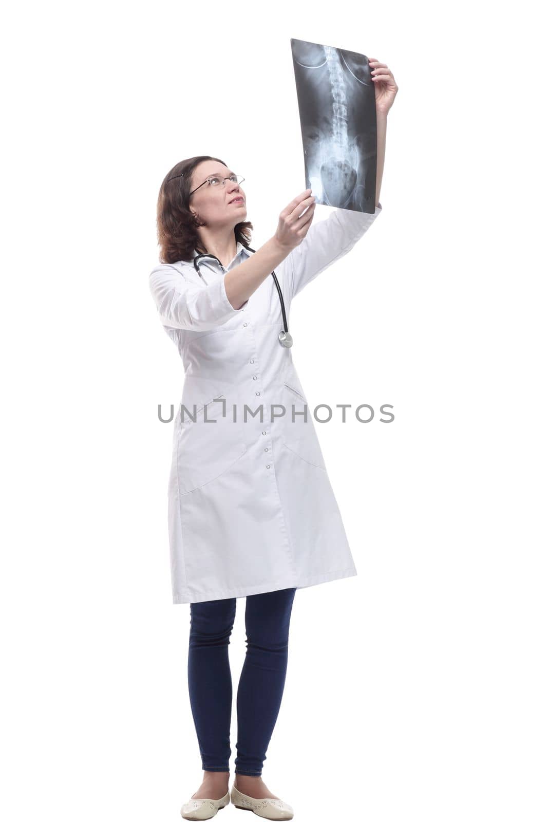 Mature female doctor looking at an x-ray. isolated on a white background.