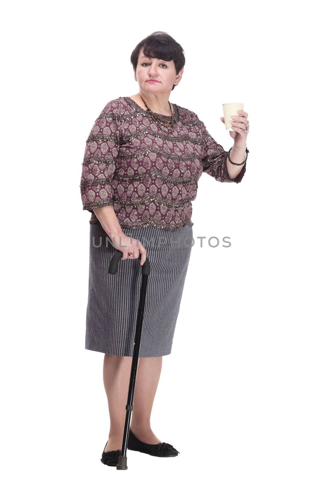 full-length. casual elderly woman with takeaway coffee. isolated on a white background.