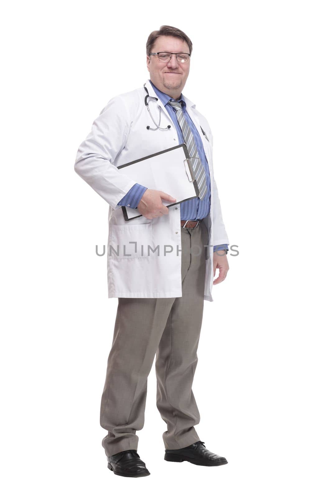 in full growth. qualified doctor with a clipboard.isolated on a white background.
