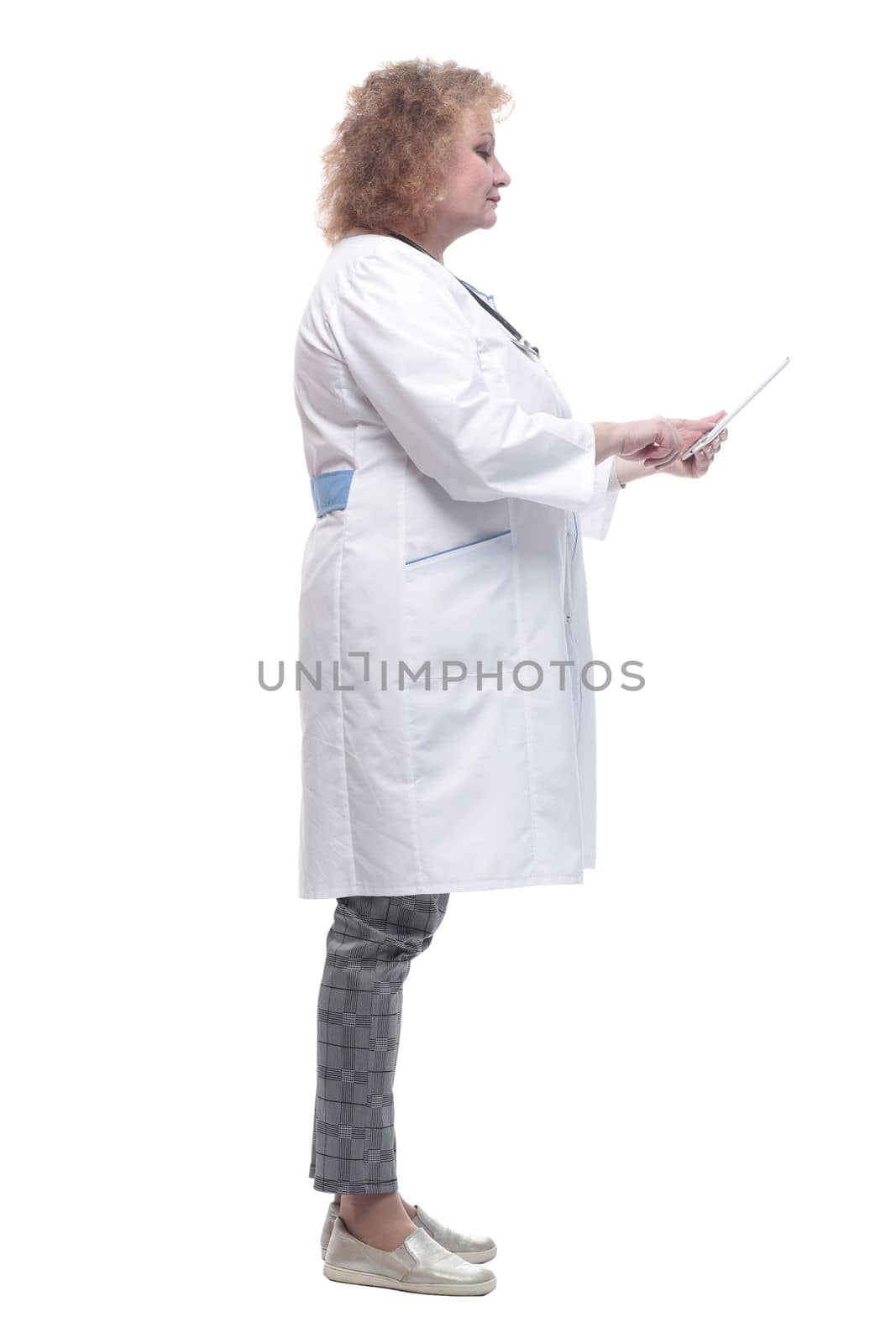 full-length. senior female doctor with a digital tablet. isolated on a white background.
