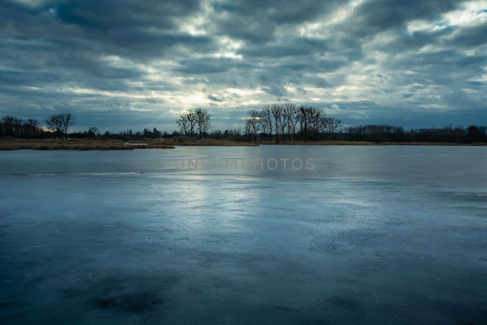 Evening view of a frozen lake and cloudy sky, Stankow eastern Poland