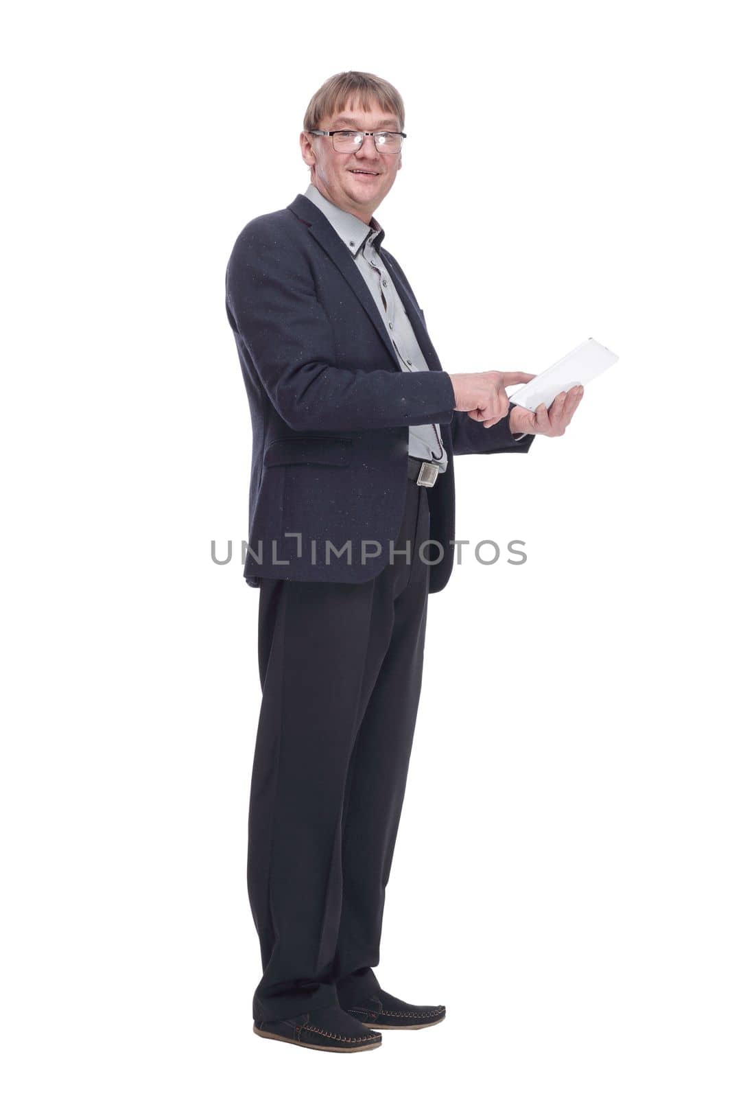 side view. senior business man using a digital tablet . isolated on a white background.
