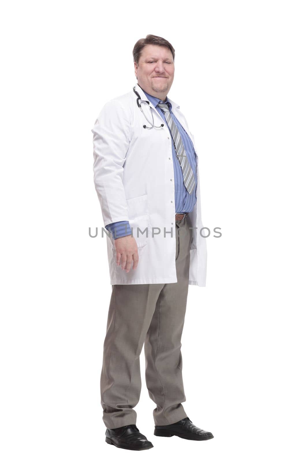 in full growth. friendly doctor in a white coat.isolated on a white background