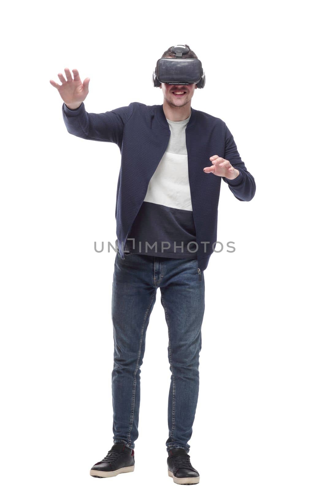 young man in a virtual reality helmet. isolated on a white background.