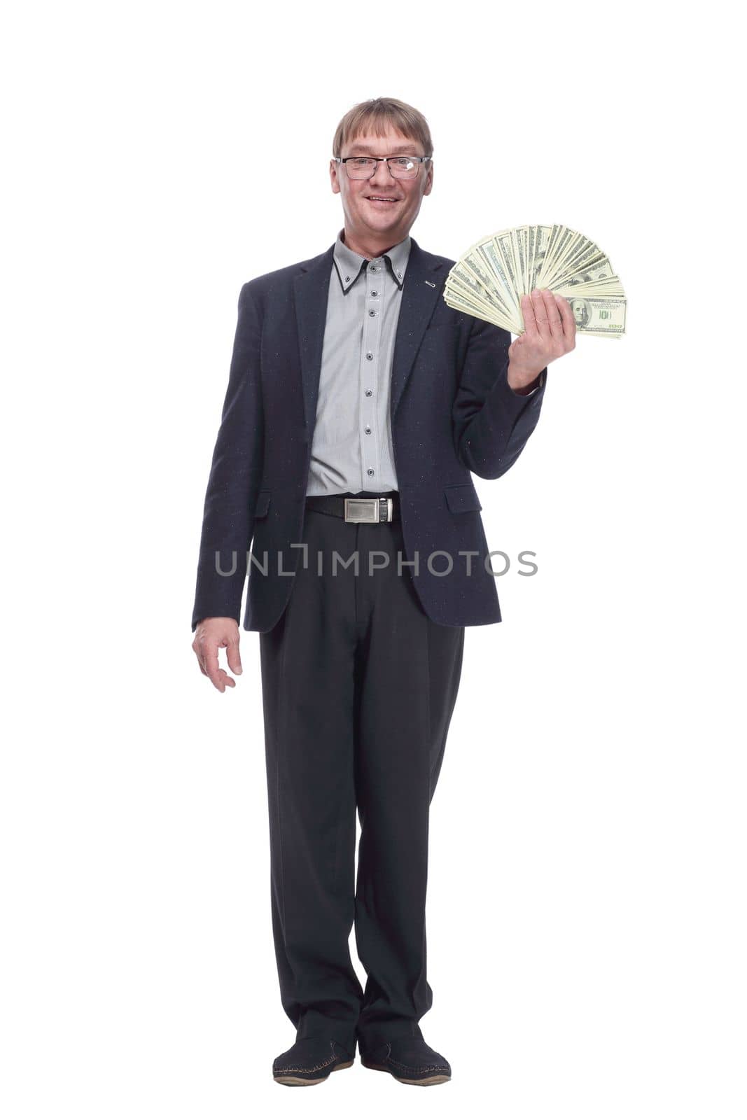 full-length. business man with a bundle of dollar bills looking at you. isolated on a white background.