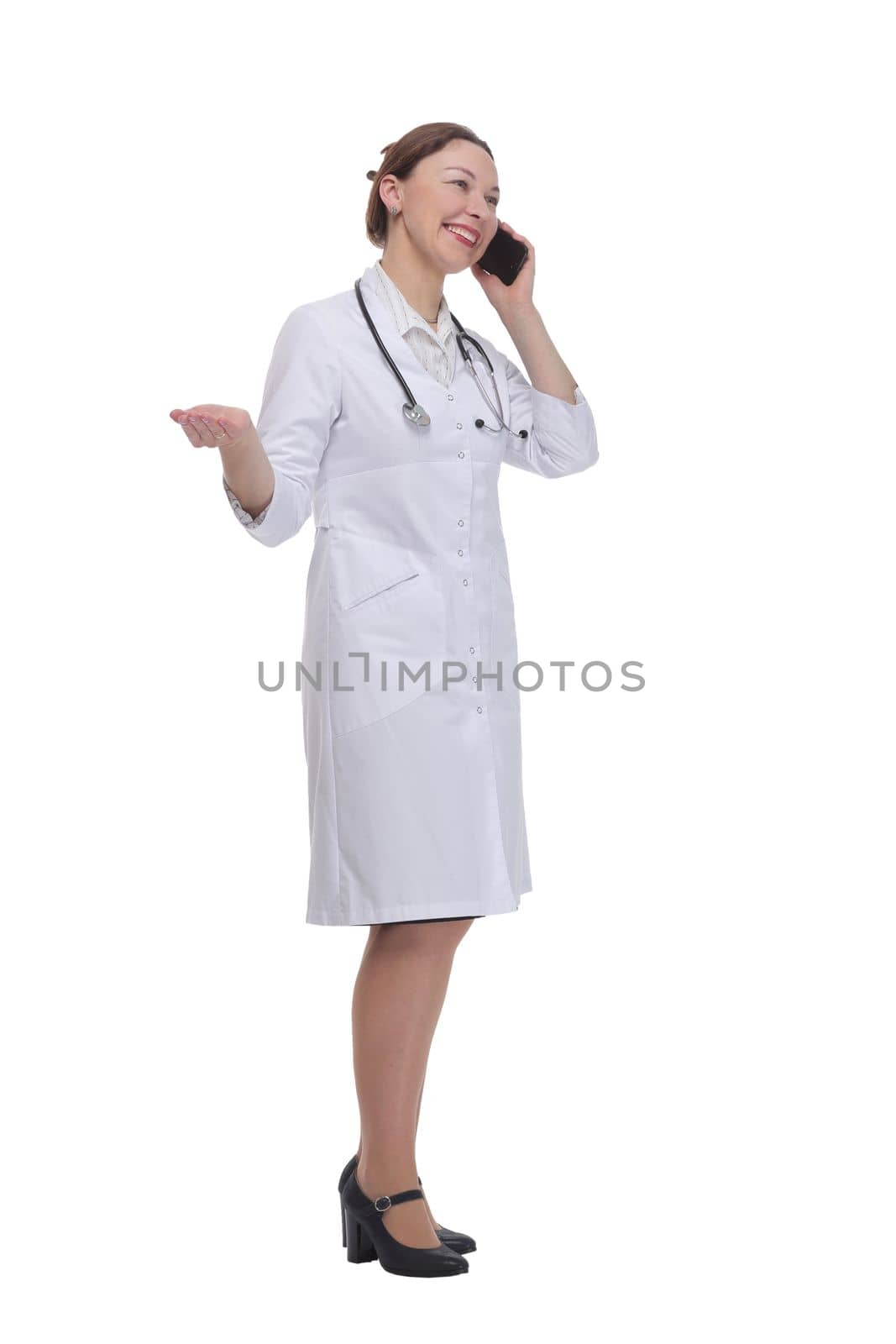 in full growth.female doctor with a smartphone. isolated on a white background.