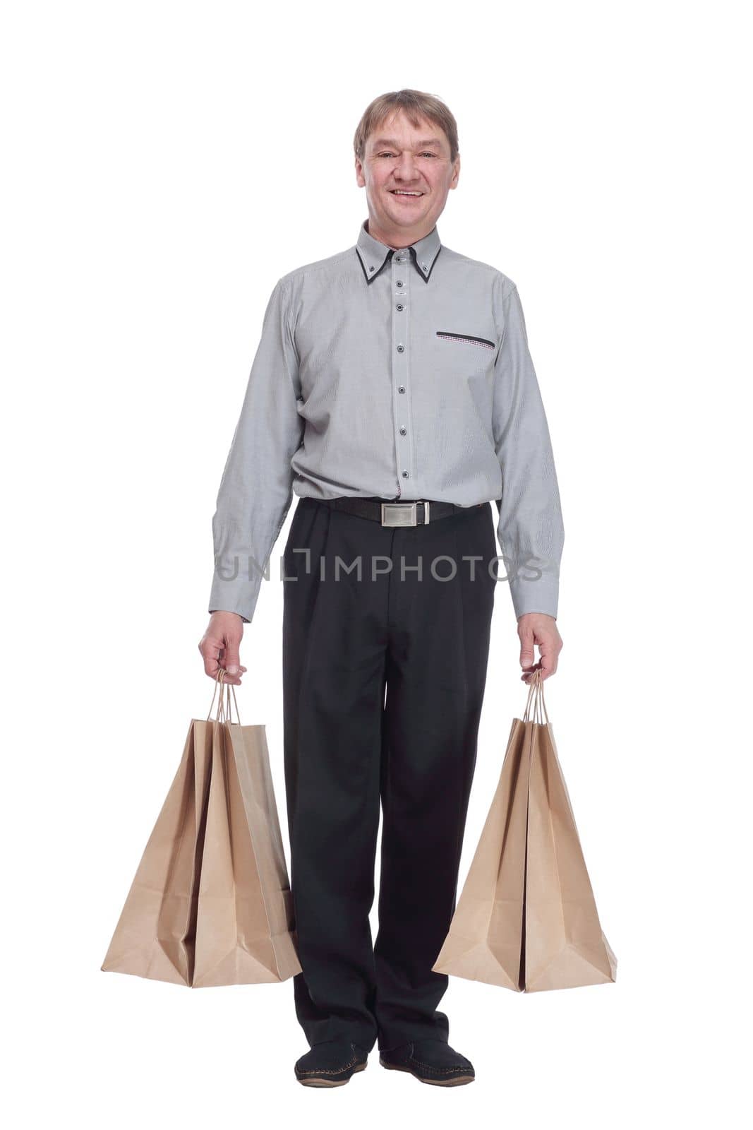 senior man with shopping bags . isolated on a white background. by asdf