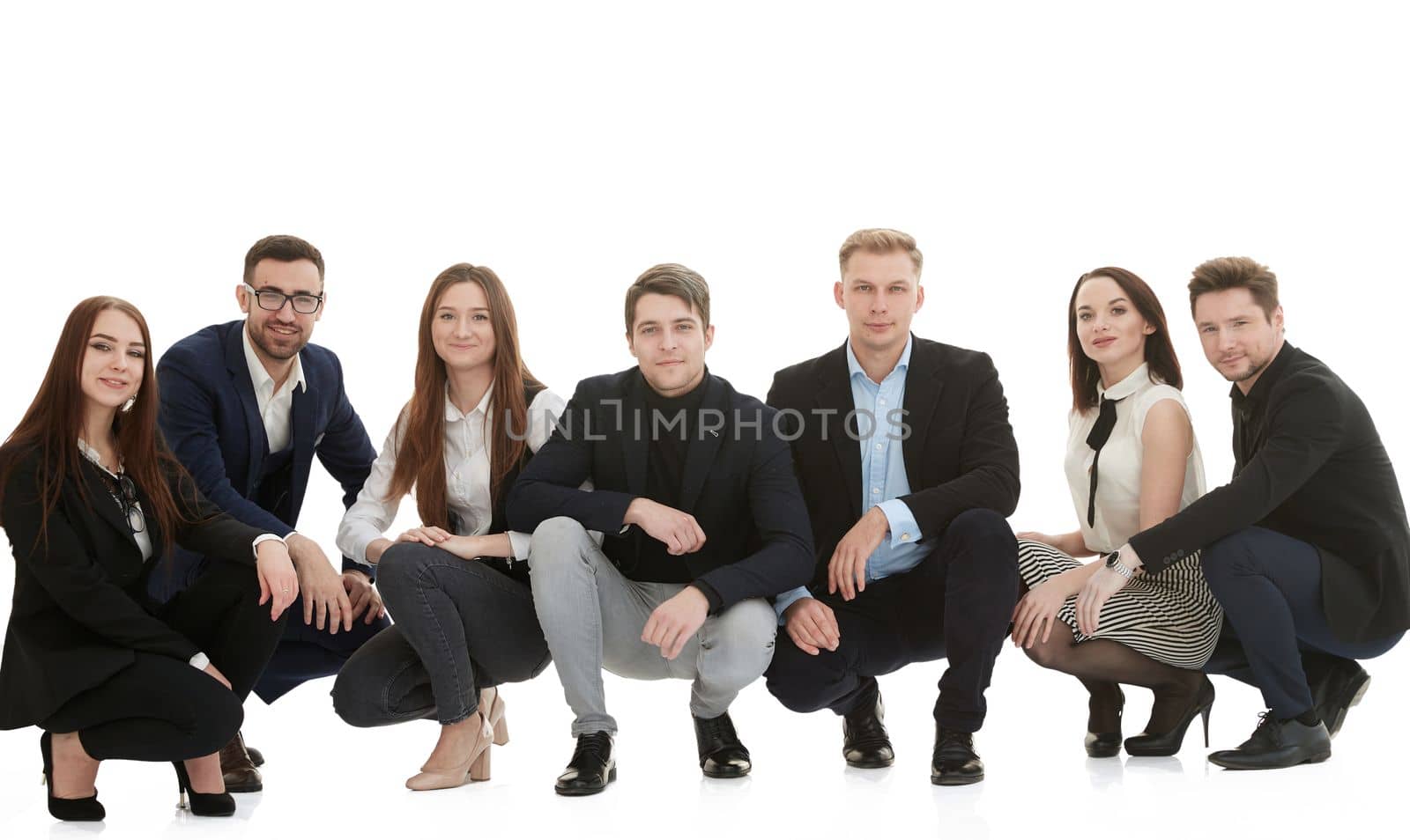in full growth. group of diverse young people standing together. isolated on a white background.