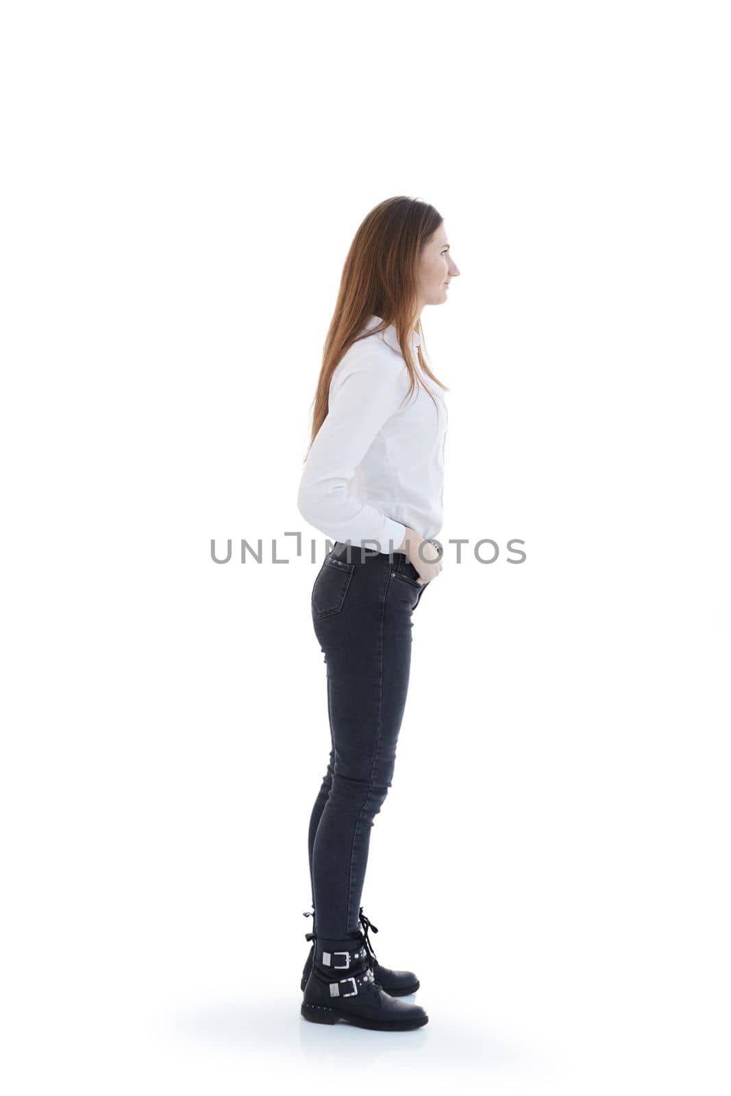 side view. attractive girl in jeans looking forward . by asdf