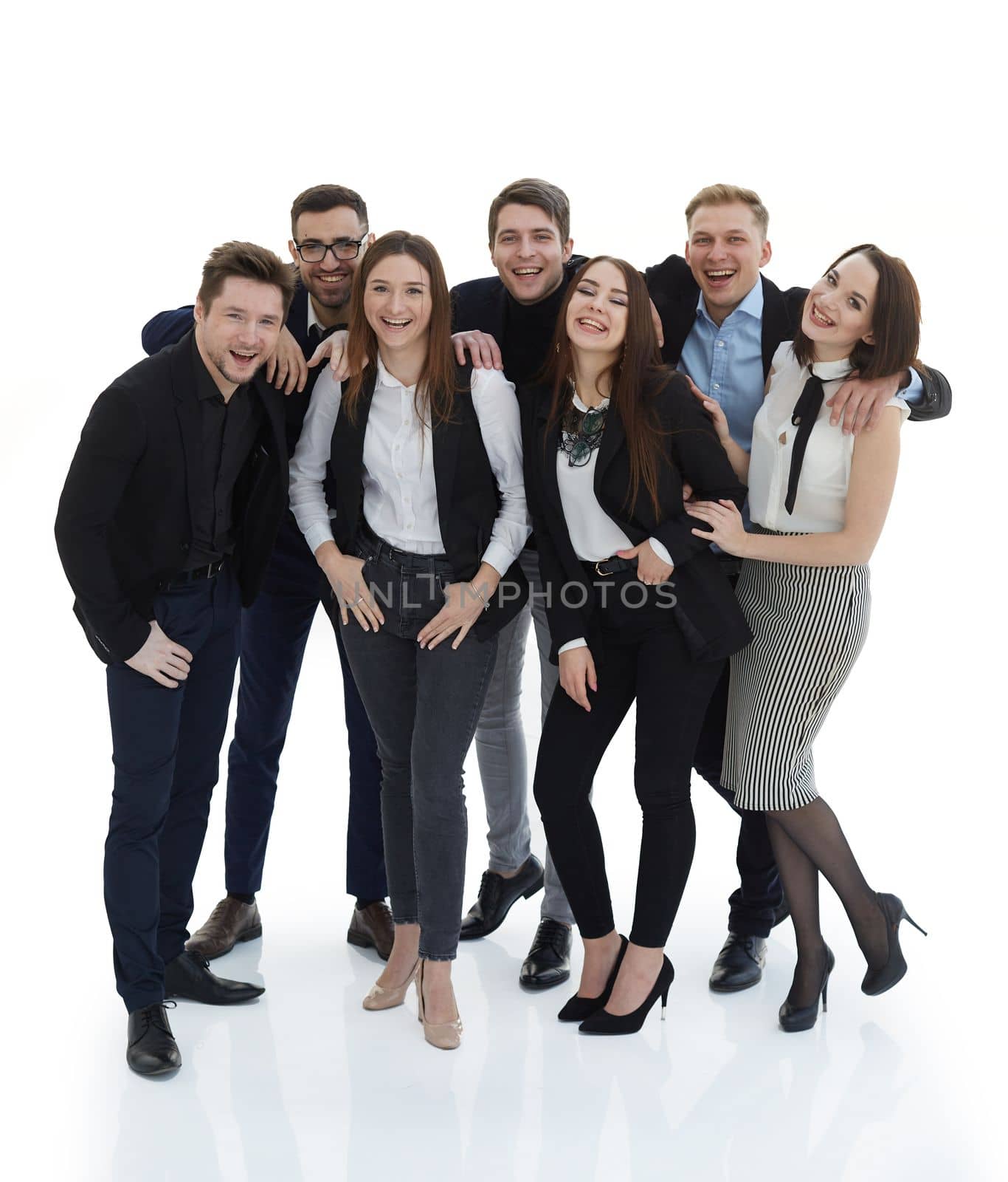 in full growth. portrait of a group of happy young people . isolated on a white background.