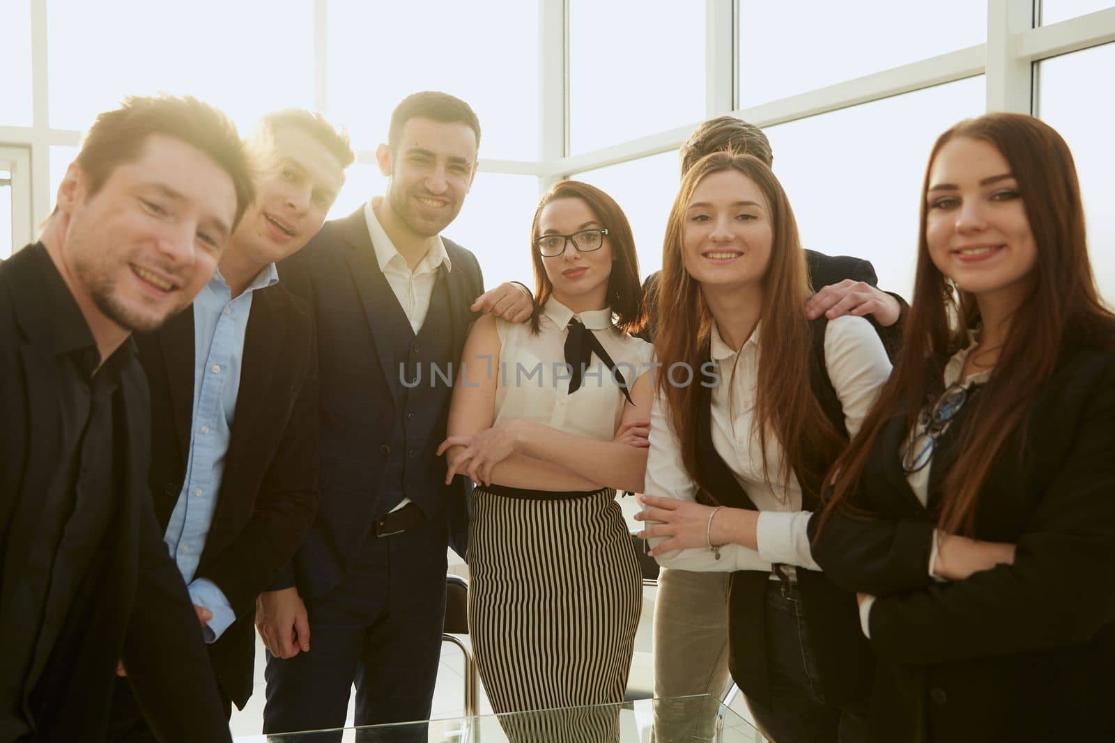 team of young professionals standing in the office. concept of teamwork.
