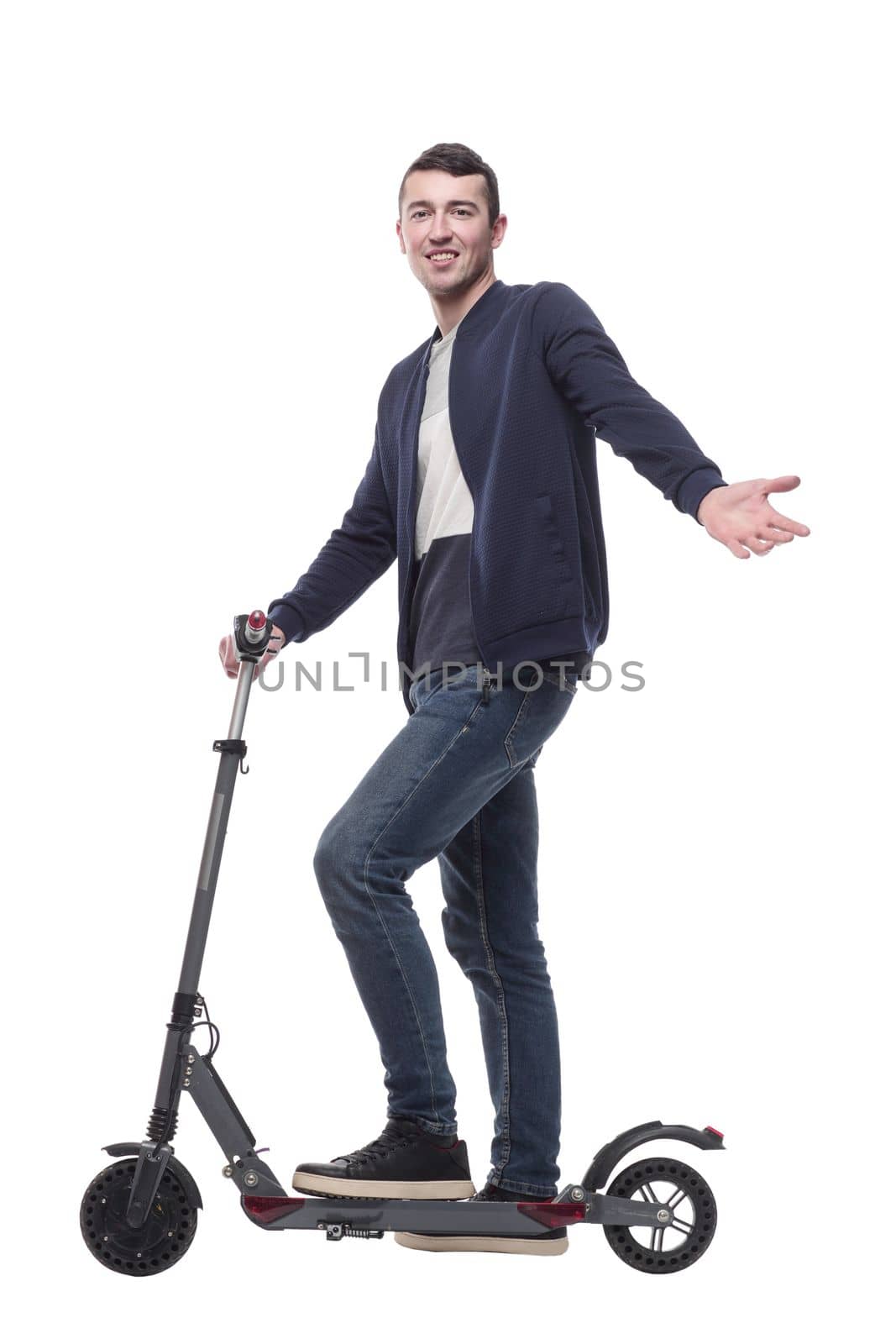 smiling young man with an electric scooter . isolated on a white background.