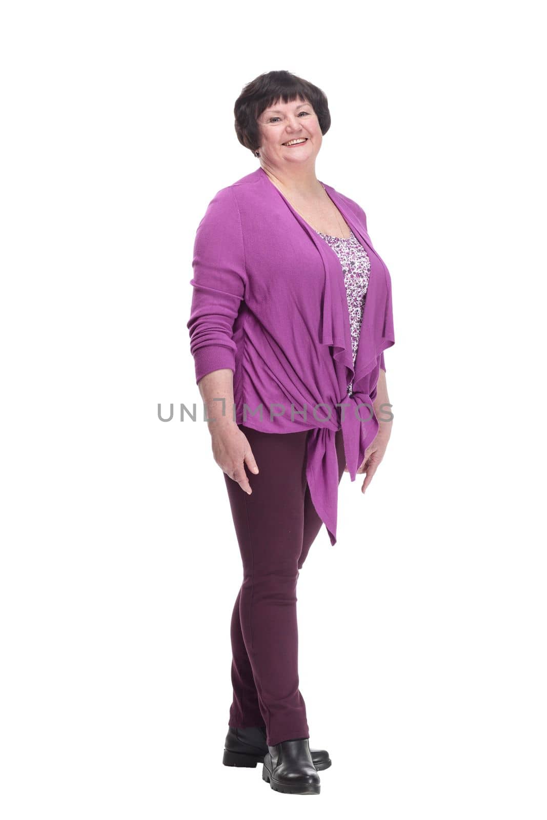 full-length.casual elderly woman in a purple blouse. isolated on a white background.