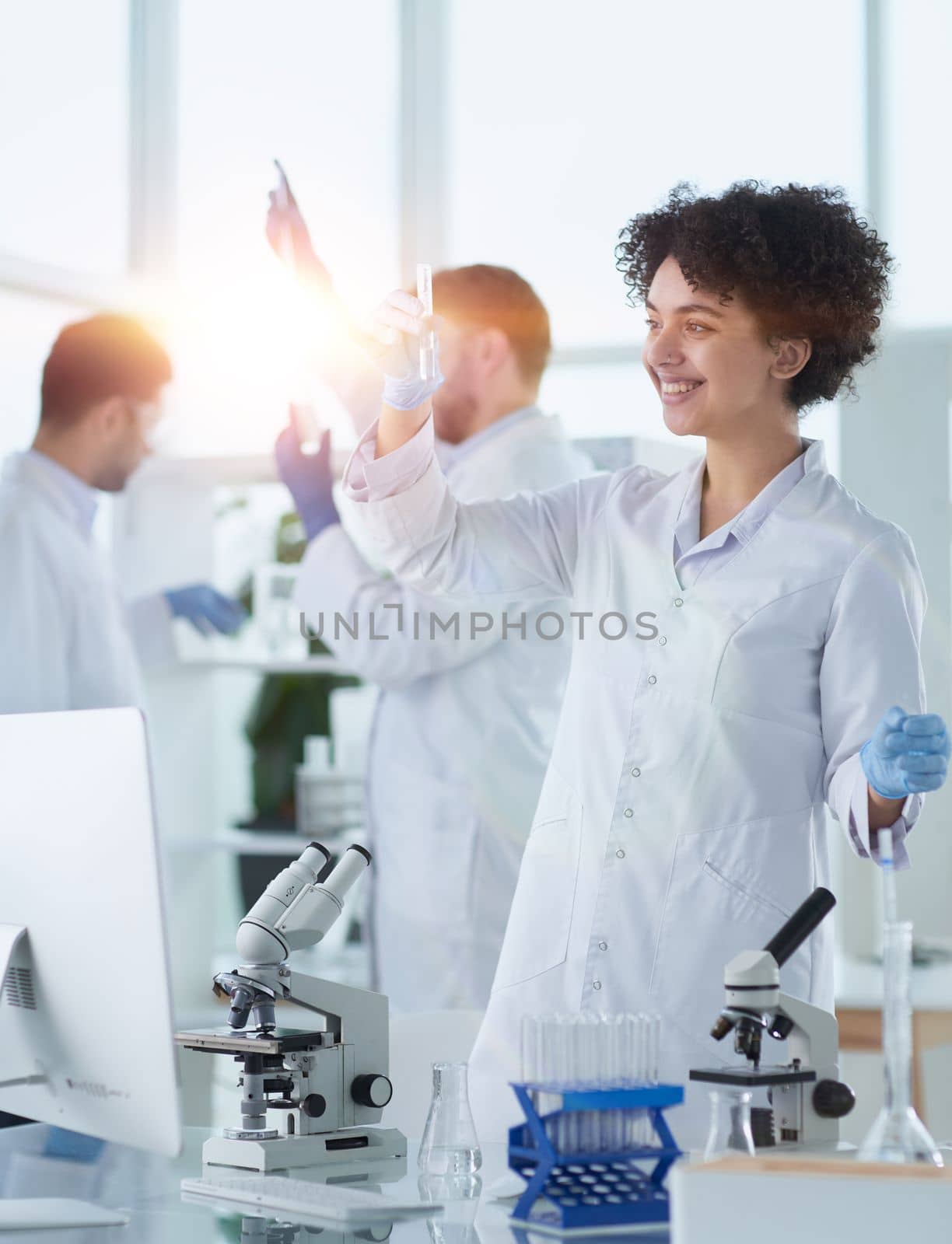 Team of Scientists Working Using Microscope, Analysing Microbiology Samples