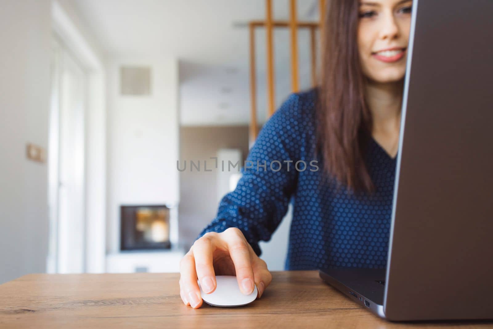 Young caucasian woman holding credit card and using laptop computer. Businesswoman working at home. Online shopping, e-commerce, internet banking, spending money, working from home concept. High quality photo
