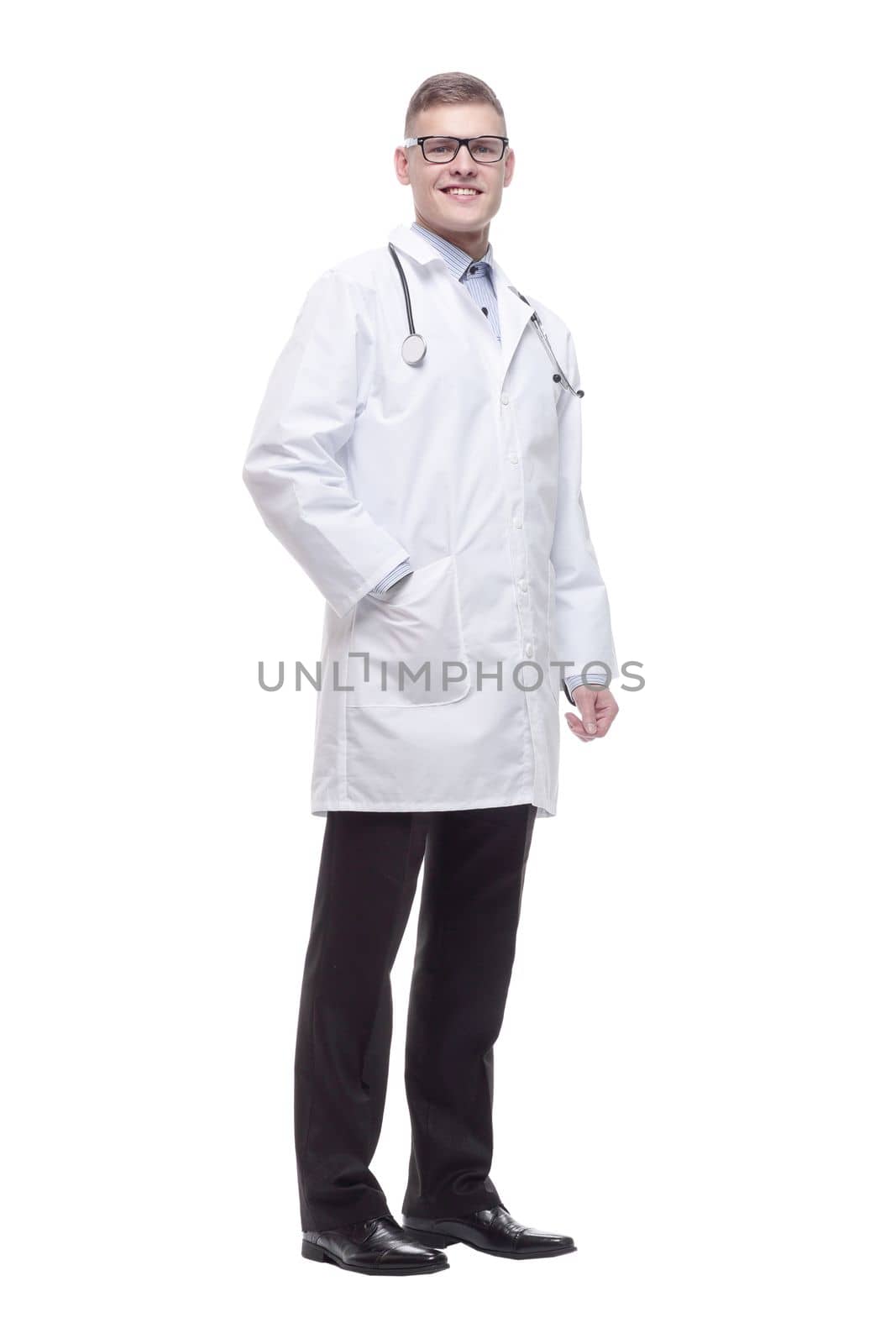 in full growth. confident young doctor with a stethoscope. isolated on a white background.