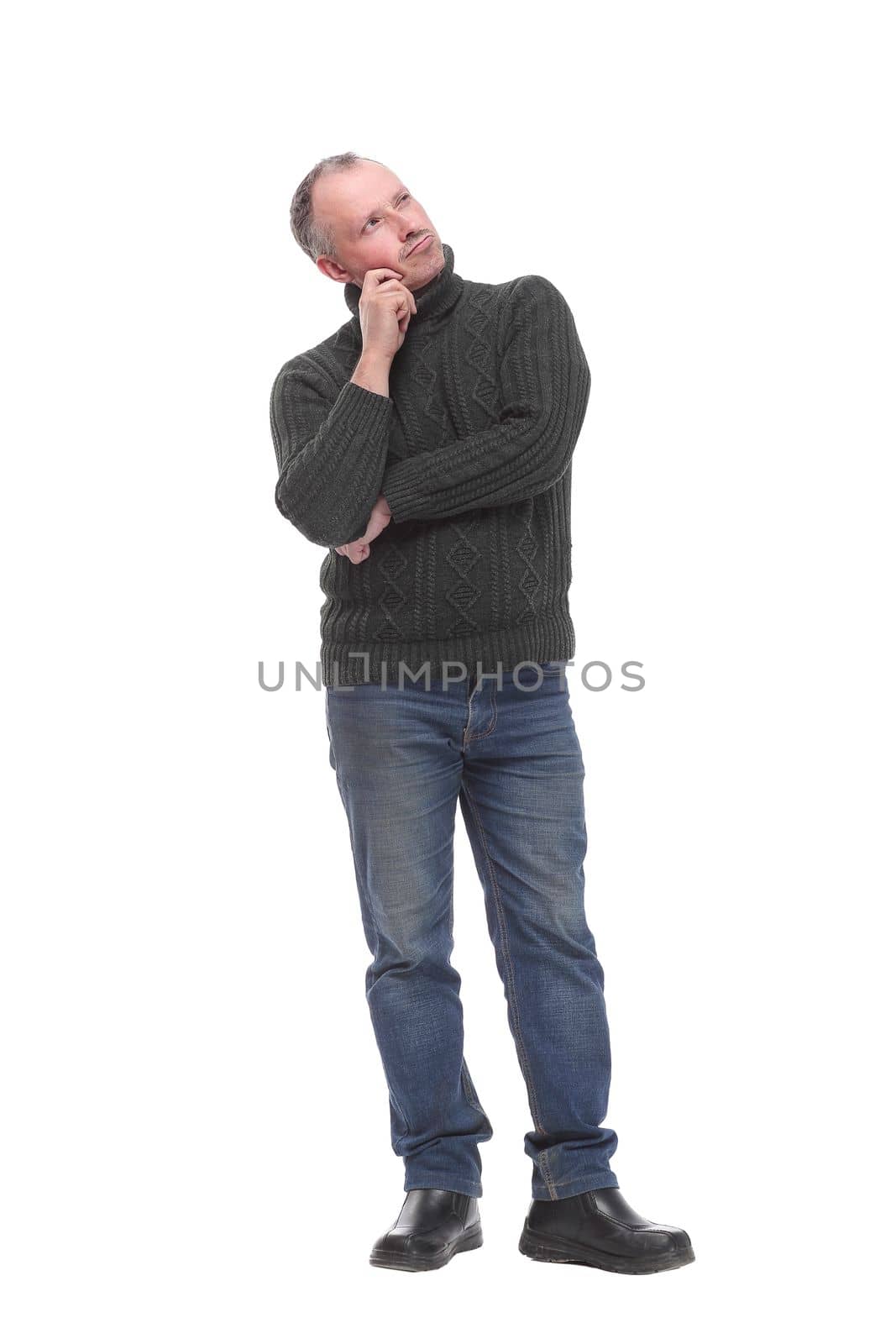 Portrait of a casual pensive businessman looking at camera posing against a white background