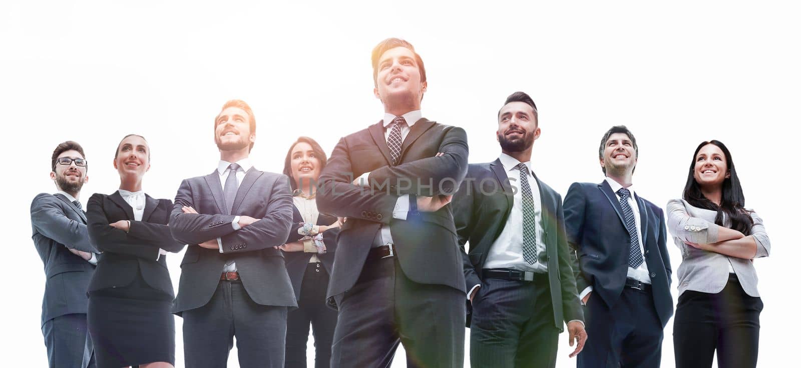Portrait of friendly business team standing in isolation