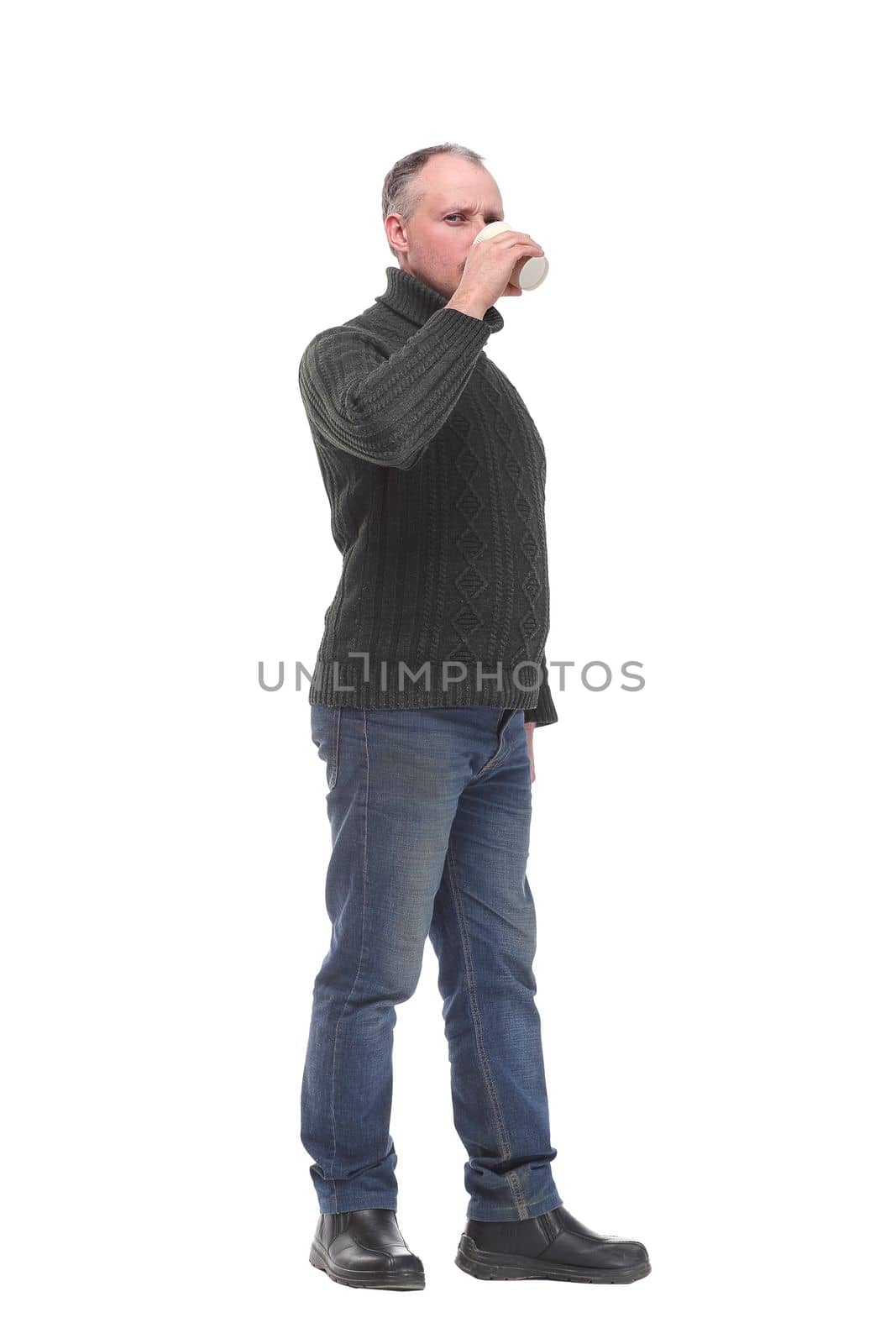 Man drinking a coffee or tea isolated on white background. Concept of break time