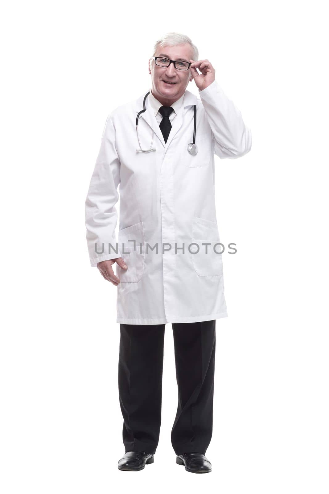 in full growth.qualified mature doctor with stethoscope. isolated on a white background.