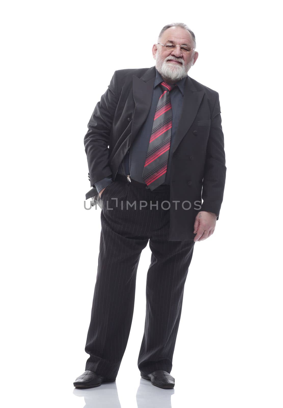 in full growth. confident bearded businessman looking at the camera . isolated on a white background