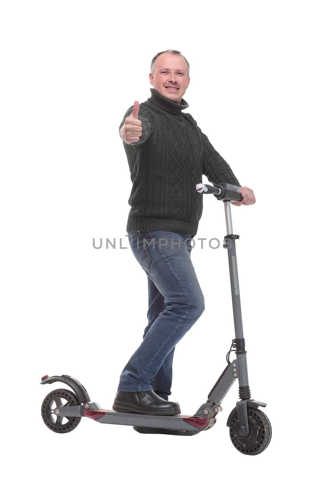 Side view of young modern man using and driving electric isolated over white background. Modern and ecological transportation concept.