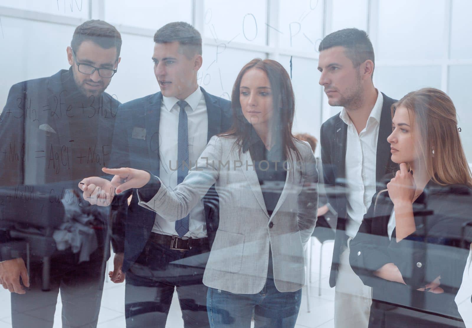 close up. business team standing in front of a glass wall.