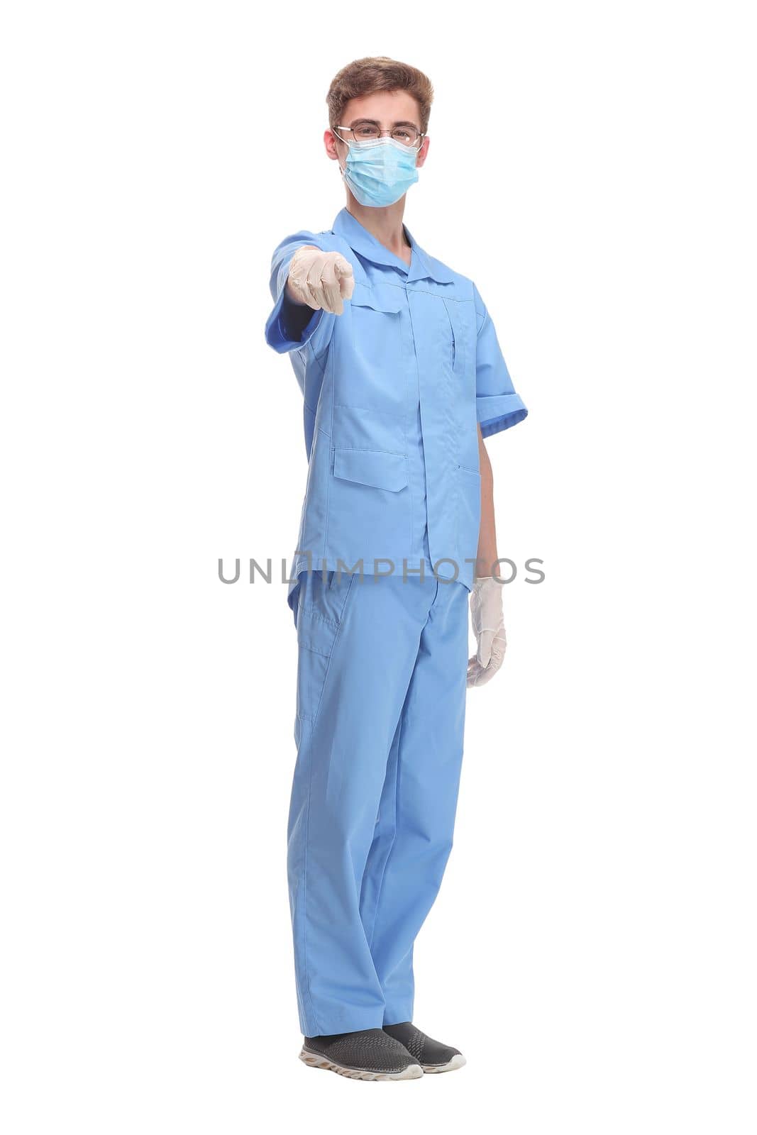 Doctor wearing a surgical mask against infections standing with crossed arms in a lab coat isolated on white by asdf