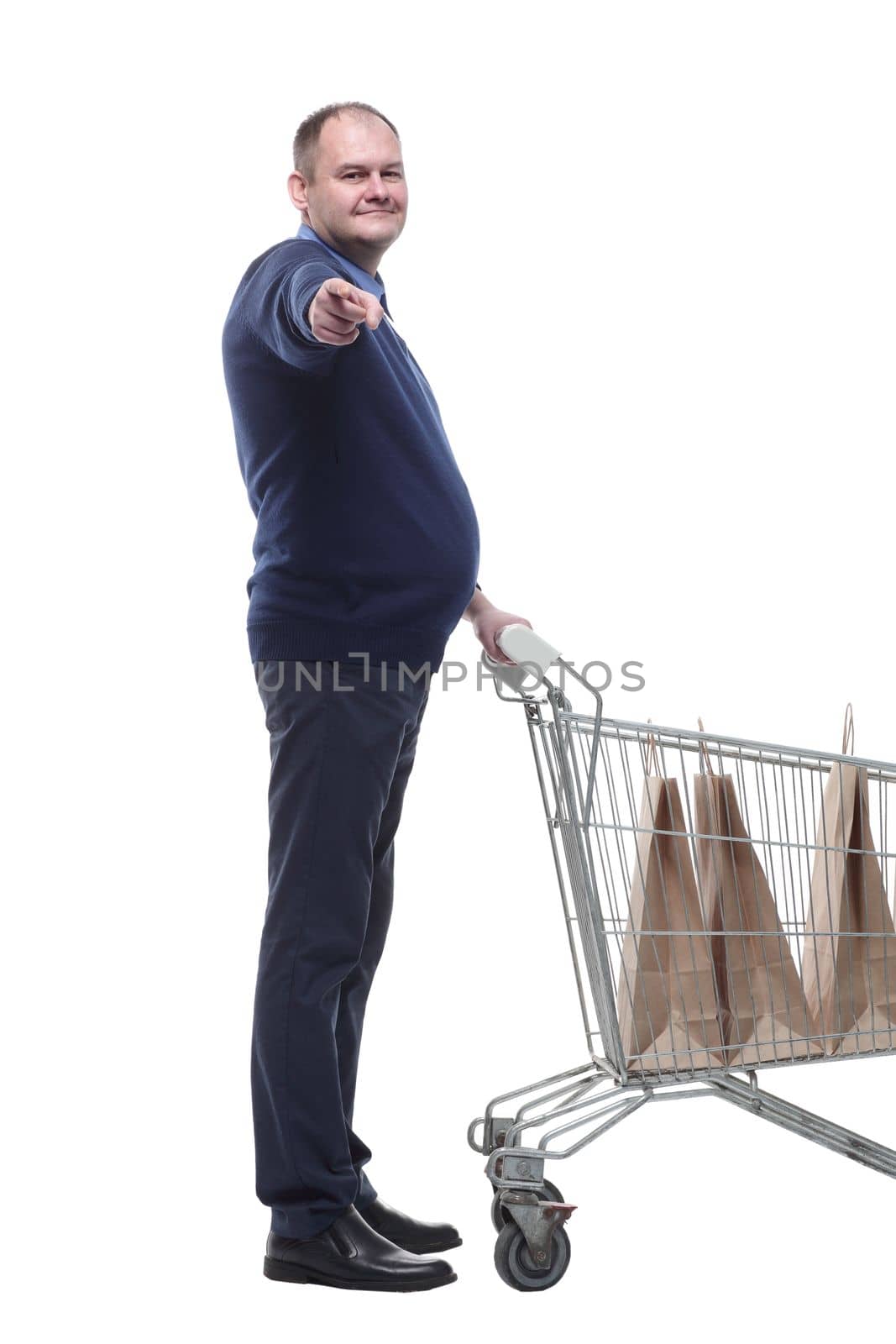 in full growth. casual mature man with shopping cart. isolated on a white background.