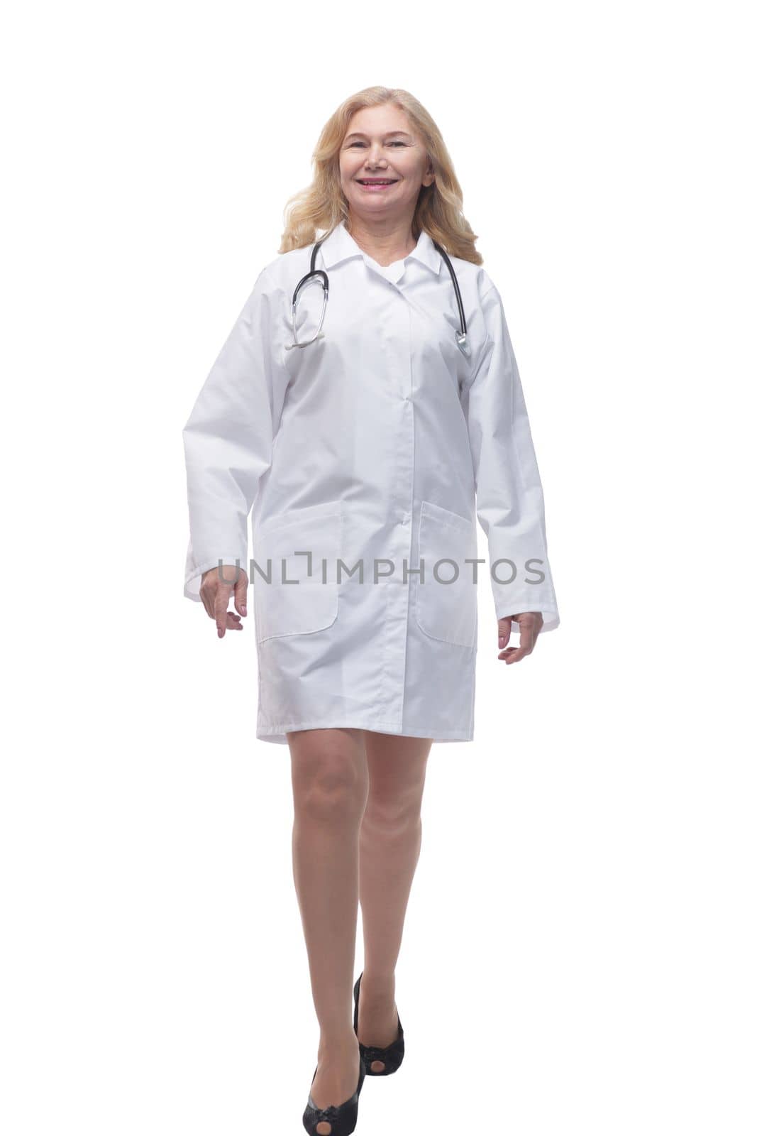 full length . successful woman doctor stepping forward . isolated on white background.