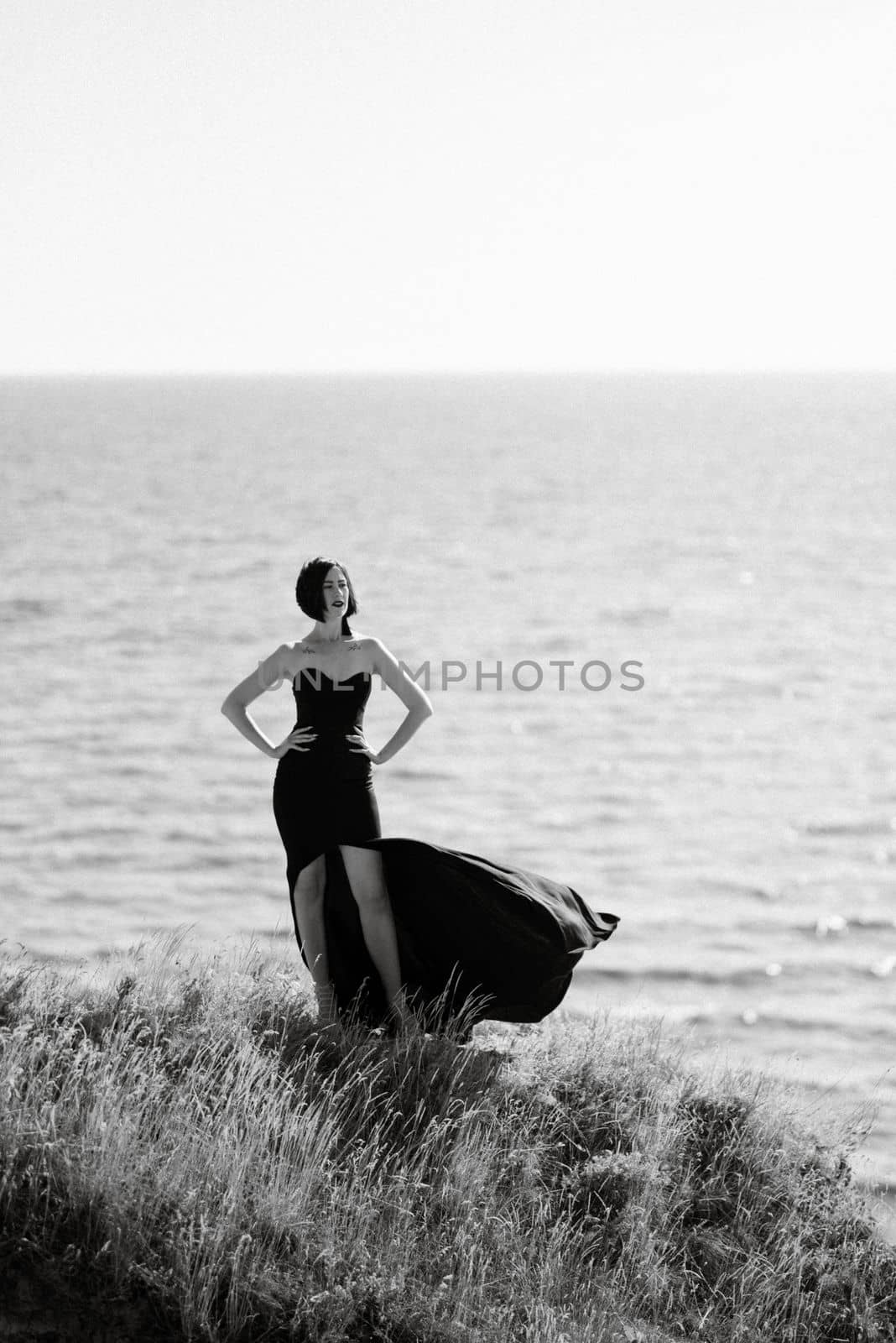 tall girl model in a black dress on the mountain hills by Andreua