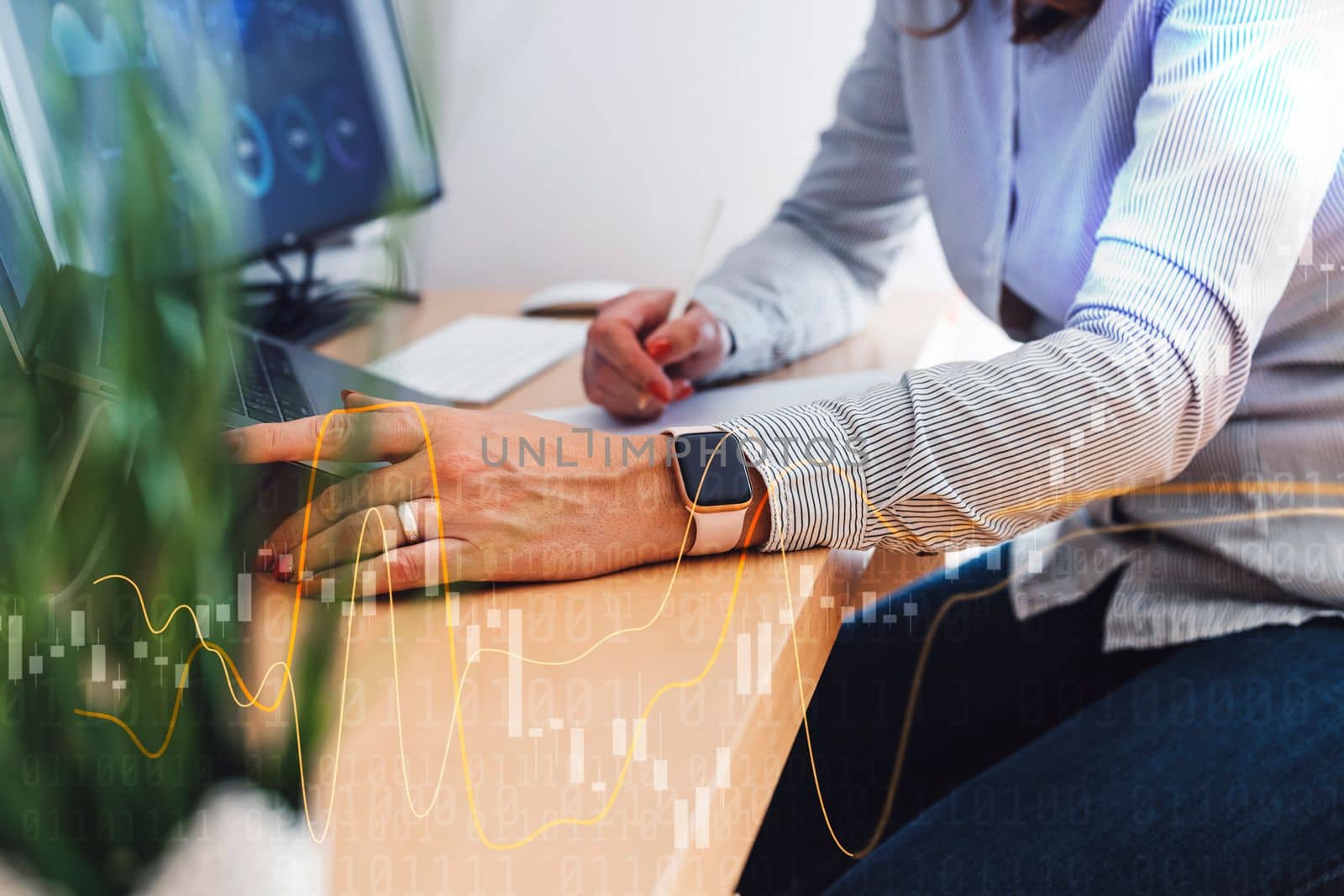 Professional businesswoman working at her office via laptop, young female manager using computer device while sitting at modern loft, computer graphics, work process concept. High quality photo