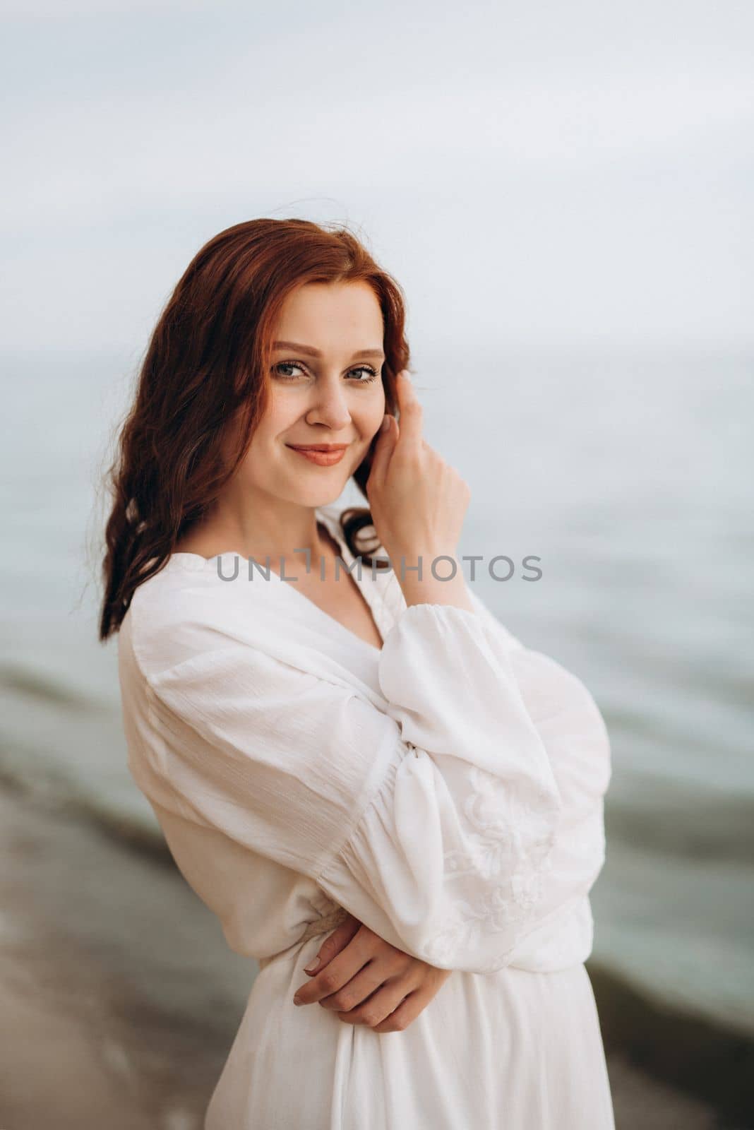 pregnant girl with brown hair on the seashore by Andreua