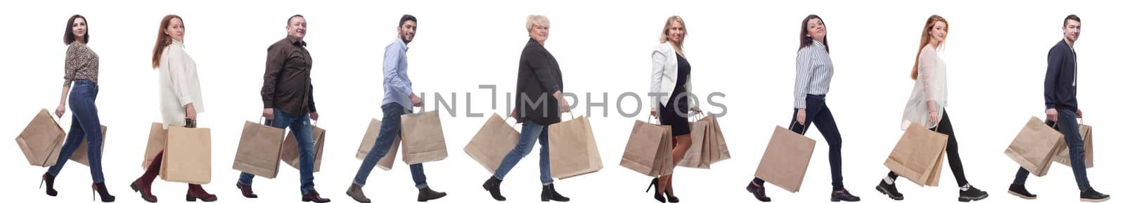 a line of people with shopping bags. side view by asdf