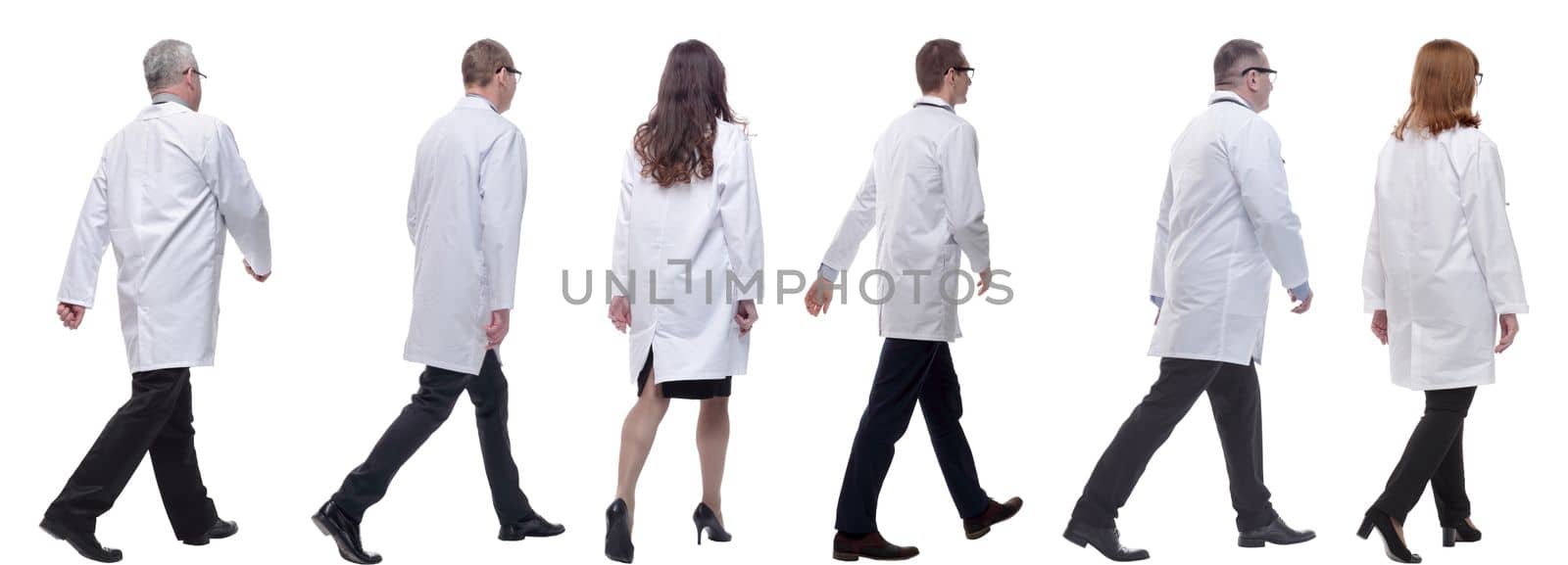 group of doctors in motion isolated on white background