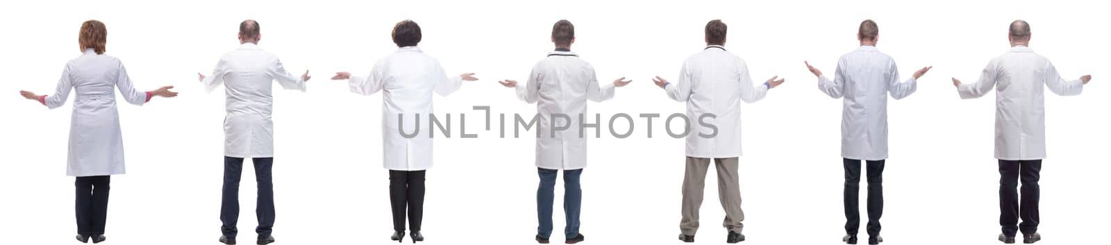 group of doctors standing with their backs isolated on white background