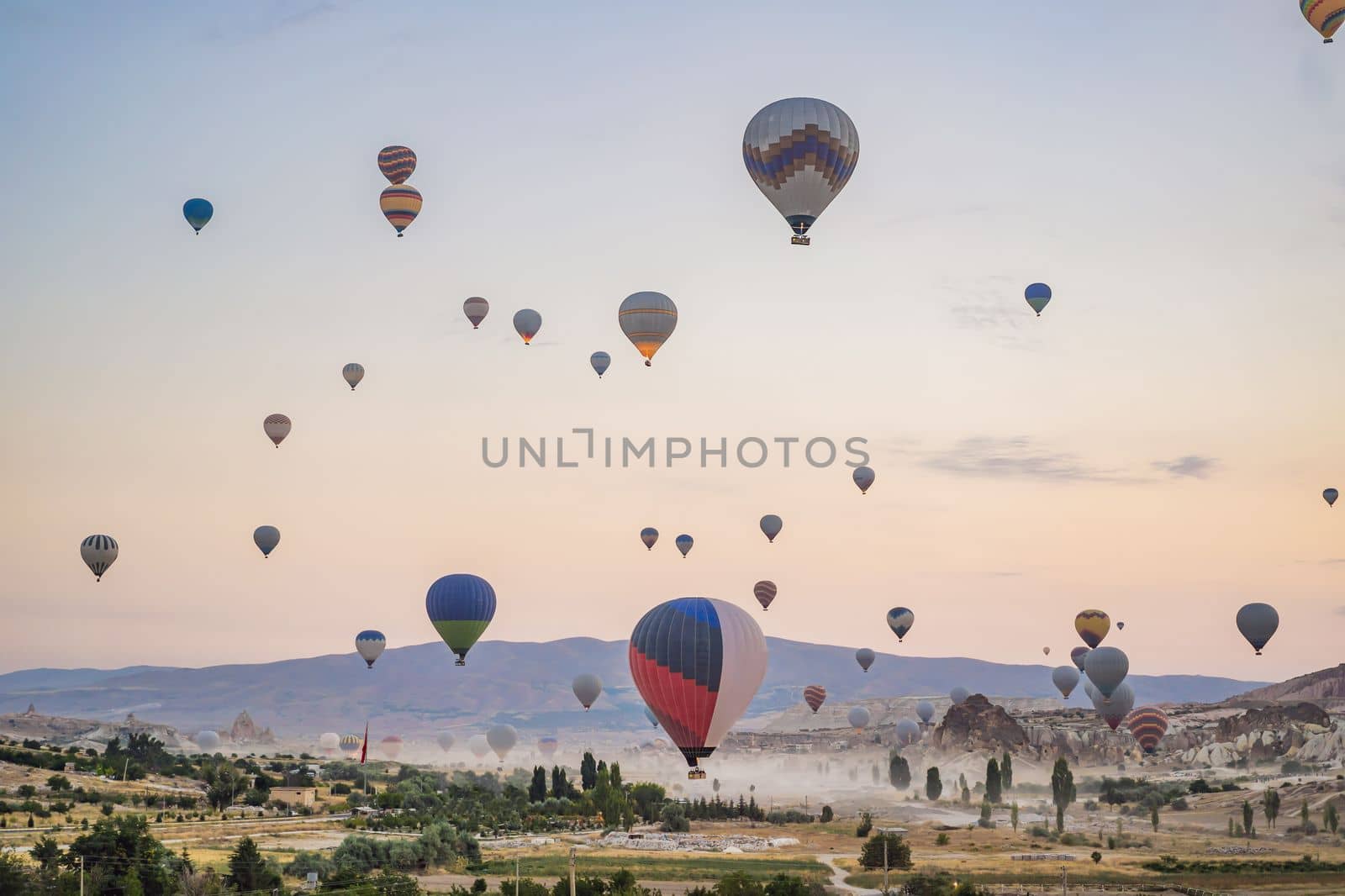 Colorful hot air balloon flying over Cappadocia, Turkey.