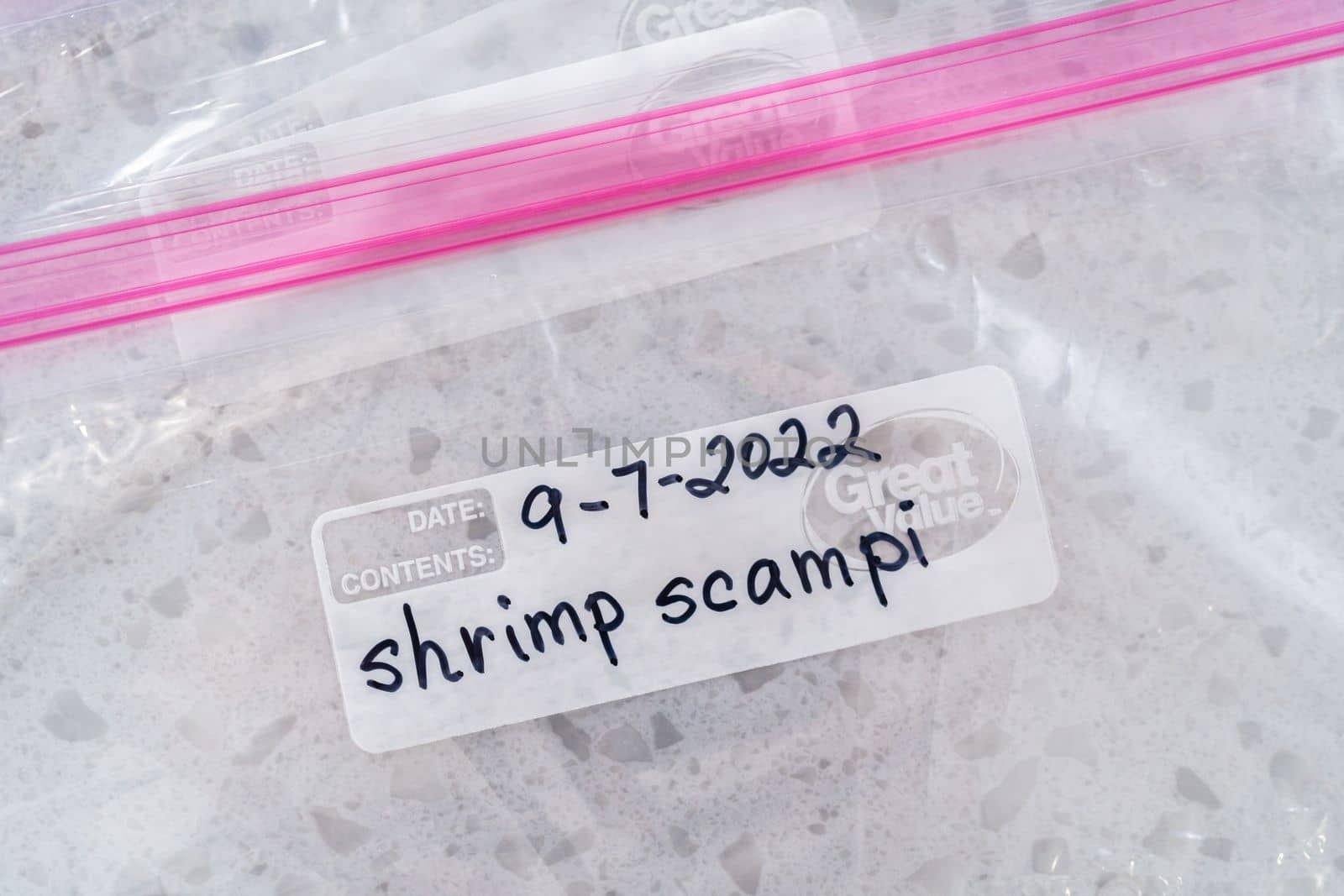 Colorado Springs, Colorado, USA-September 7, 2022-Empty plastic bags to package homemade frozen shrimp scampi meal prep.