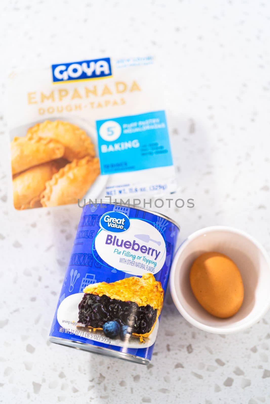 Denver, Colorado, USA-August 15, 2022-Measured ingredients in glass mixing bowls to make sweet empanadas with blueberries.