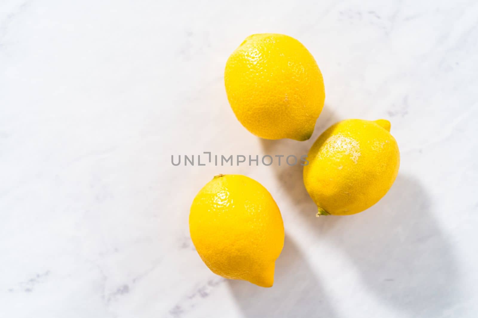 Preparing lemon swirls from the organic lemon to decorate the cocktail.
