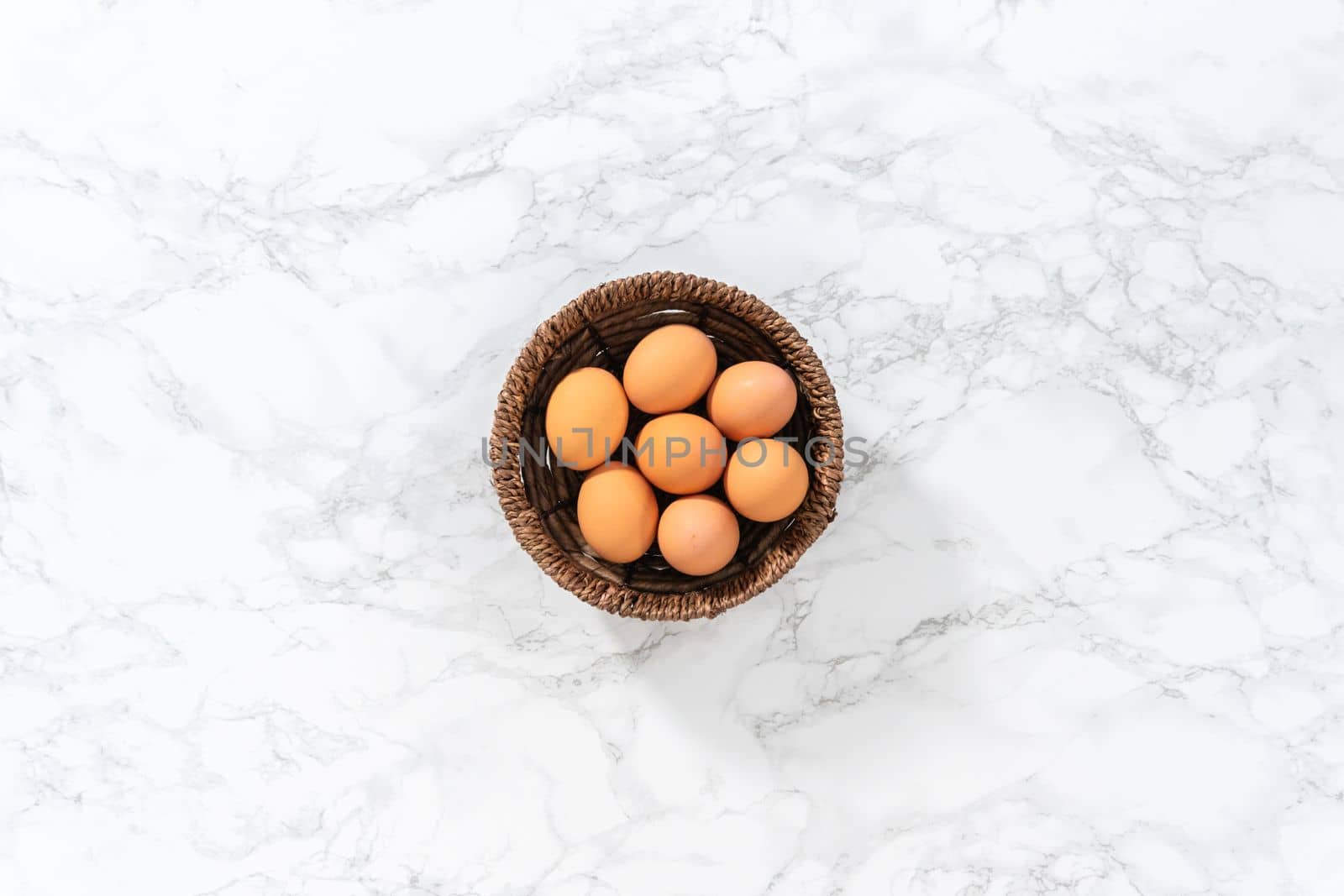 Flat lay. Measured ingredients in glass mixing bowls to make no-peel hard-boiled eggs.