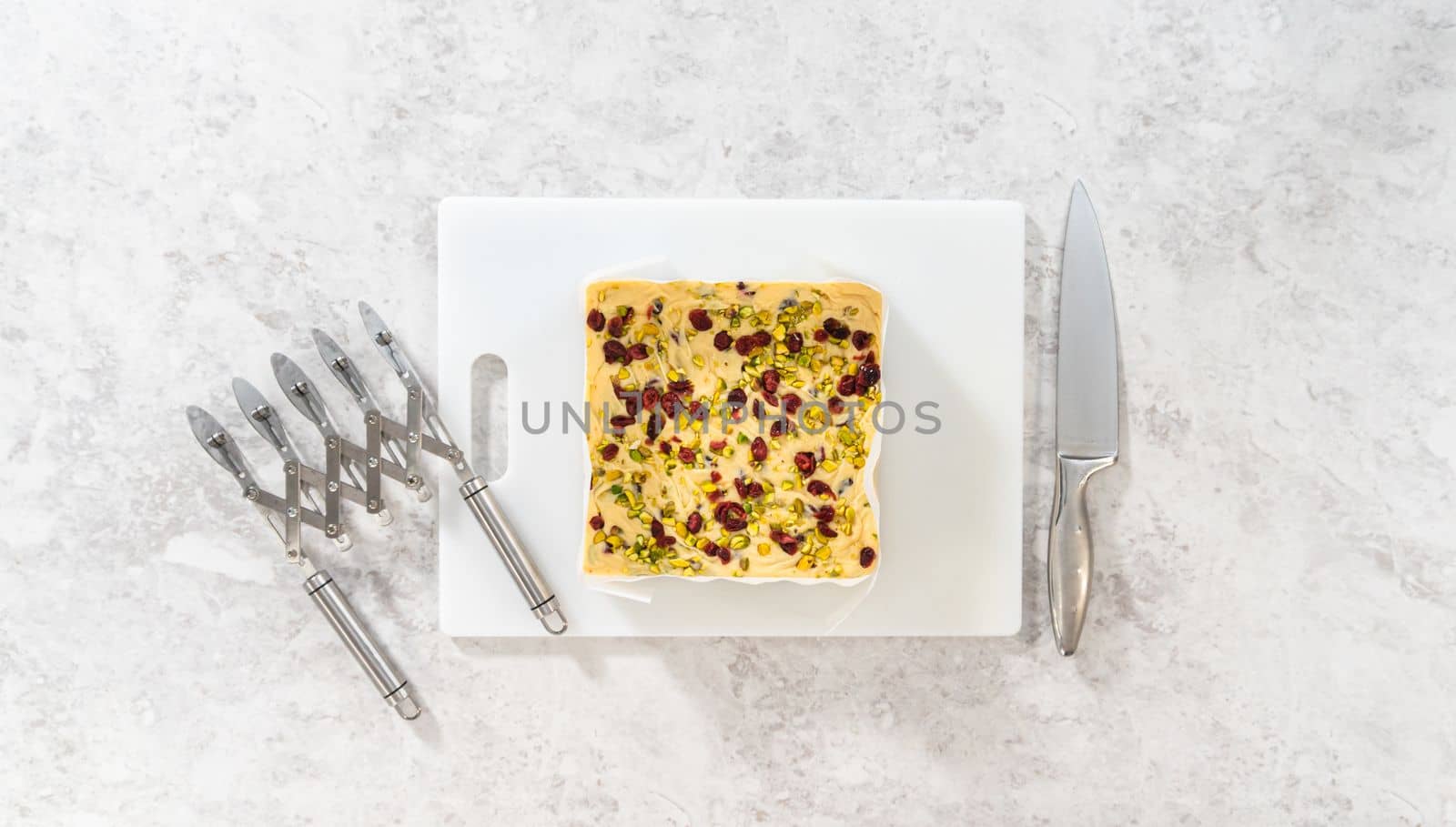 Flat lay. Storing cranberry pistachio fudge into the reusable plastic bag.