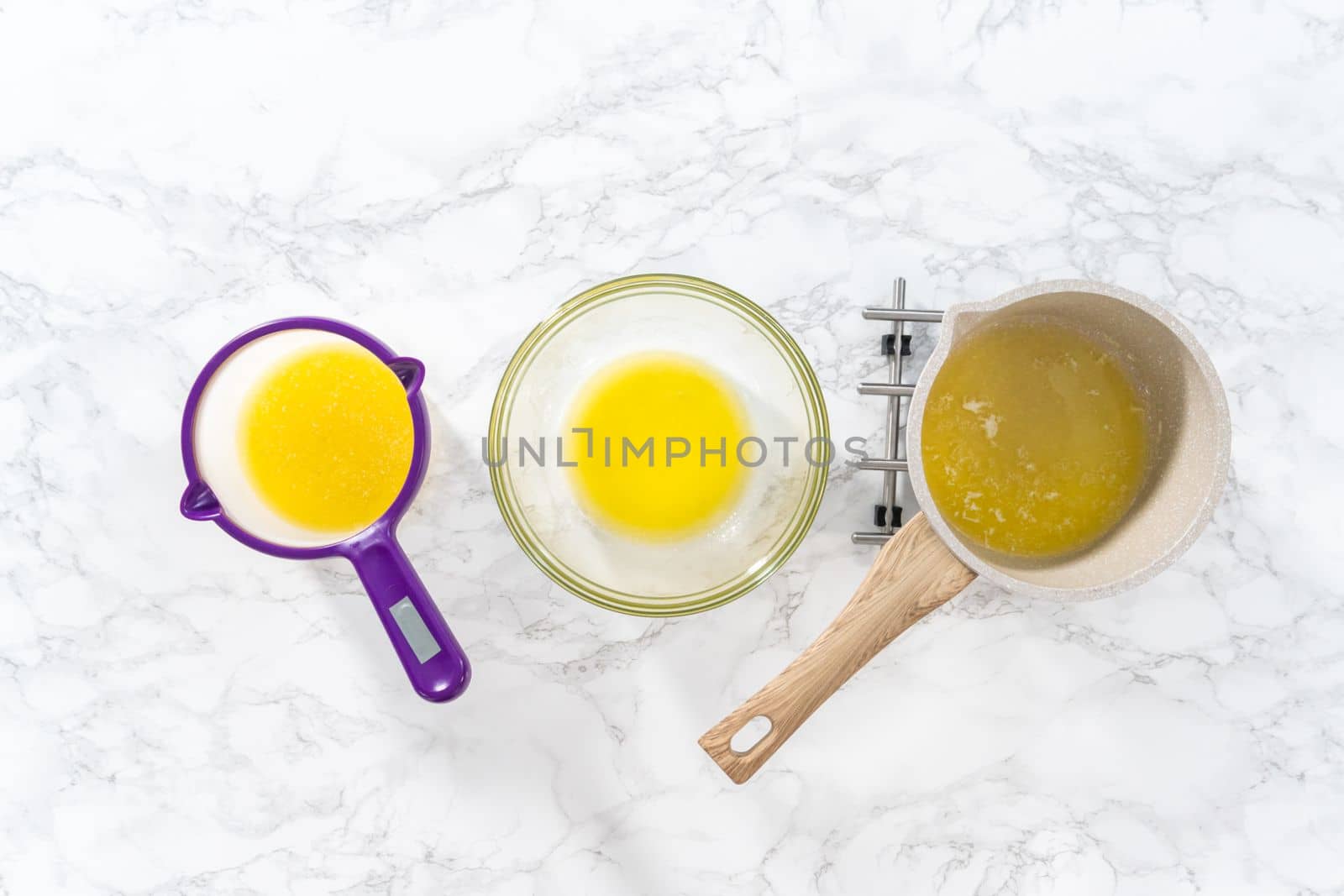 Flat lay. Melted sticks of unsalted butter on the counter.