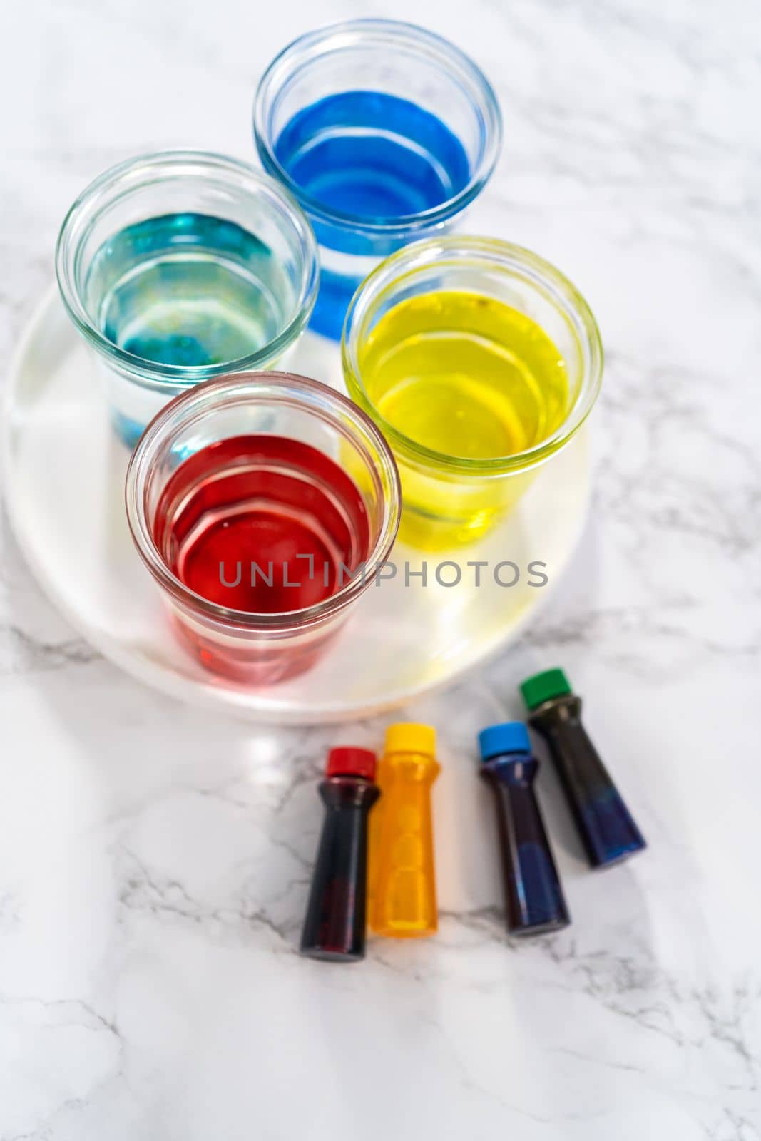 Coloring hard-boiled white eggs with natural food coloring.