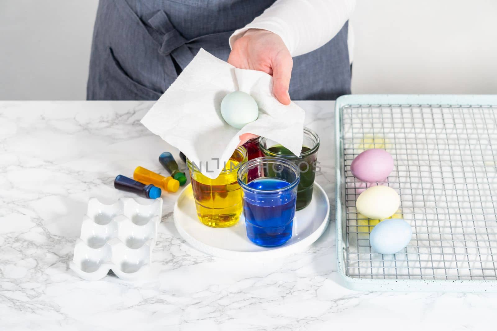 Coloring hard-boiled white eggs with natural food coloring.