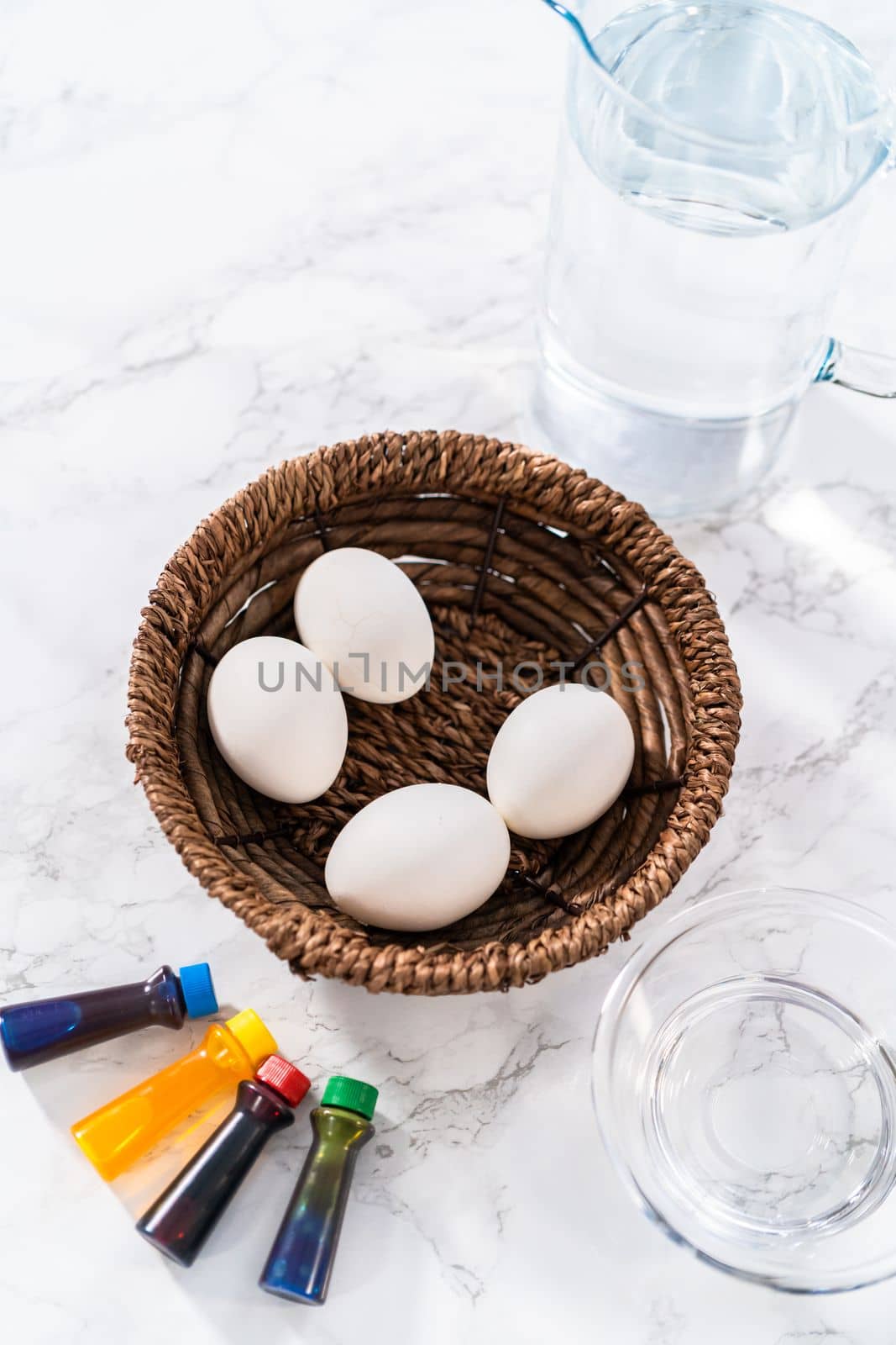 Coloring hard-boiled white eggs with natural food coloring.