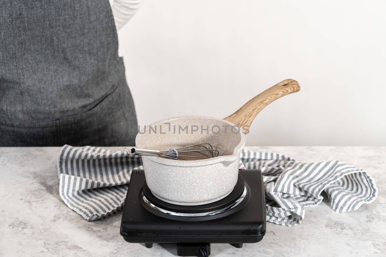 Preparing simple syrup in a small cooking pot.