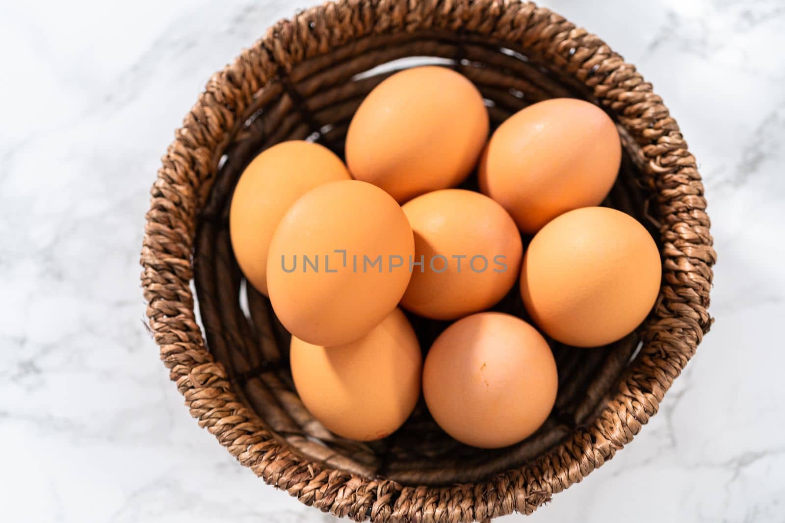 Measured ingredients in glass mixing bowls to make no-peel hard-boiled eggs.