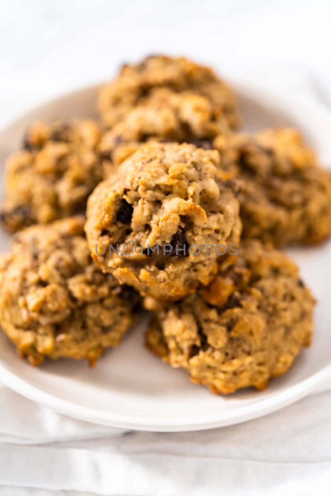 Freshly baked soft oatmeal raisin walnut cookies.